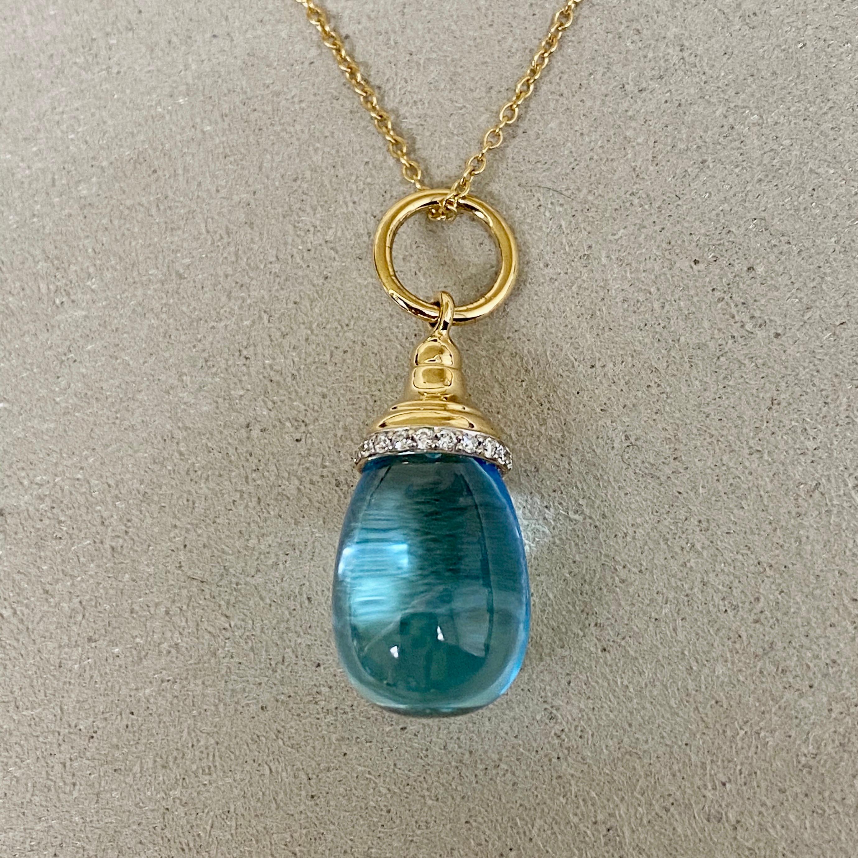 Created in 18 karat yellow gold 
Blue Topaz 15 cts approx
Diamond 0.10 ct approx
18 kyg 18 inch chain with lobster lock
Chain can be worn at 17th inch

Handcrafted in 18K yellow gold, this necklace features a dazzling 15-carat blue topaz gemstone