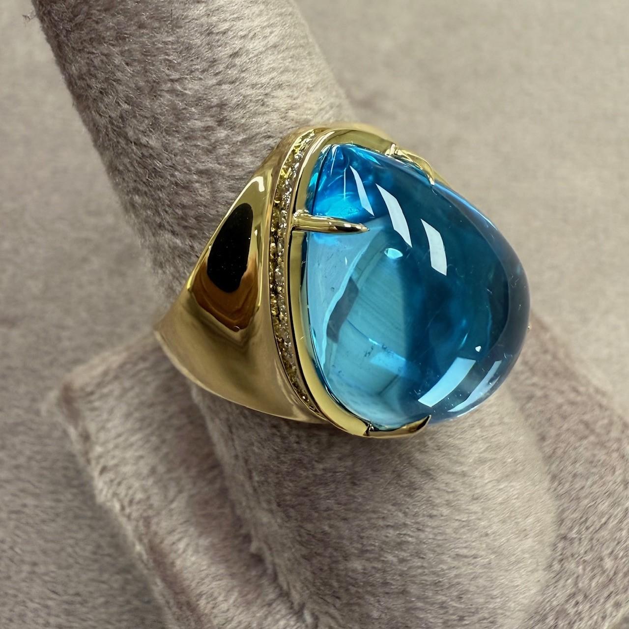 Created in 18 karat yellow gold
Blue Topaz 13 carats approx.
Diamonds 0.40 carat approx.
US size 7
Limited Edition

Crafted in luxurious 18-karat yellow gold, this limited edition ring features a dazzling Blue Topaz of approximately 13 carats,