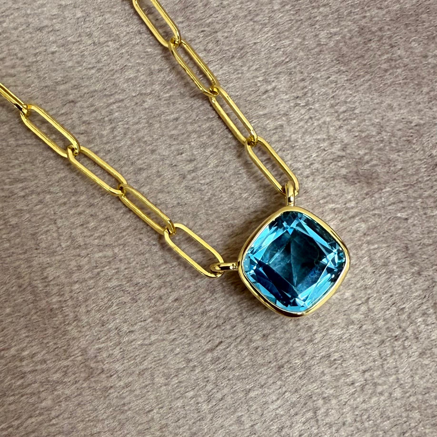 Created in 18 karat yellow gold
Blue Topaz 2 carats approx.
18 inch solid thin paper clip chain

 About the Designers ~ Dharmesh & Namrata

Drawing inspiration from little things, Dharmesh & Namrata Kothari have created an extraordinary and