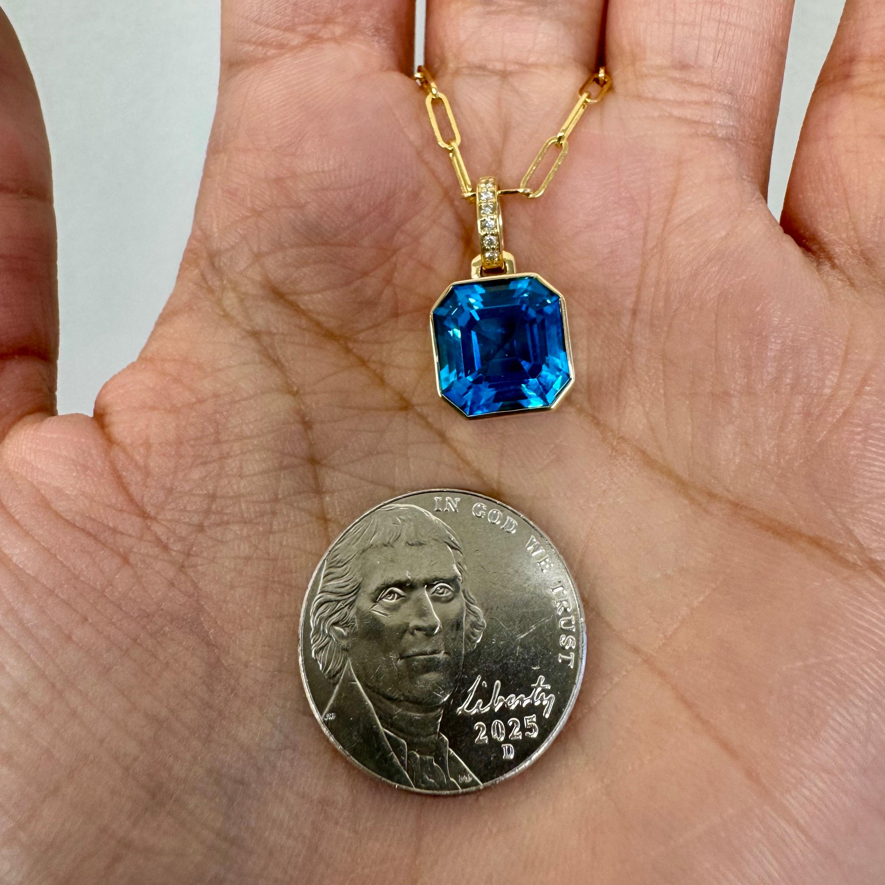 Created in 18 karat yellow gold
Blue Topaz 5.50 carats approx.
Diamonds 0.03 carat approx.
18 inch paper clip chain




 About the Designers ~ Dharmesh & Namrata

Drawing inspiration from little things, Dharmesh & Namrata Kothari have created an