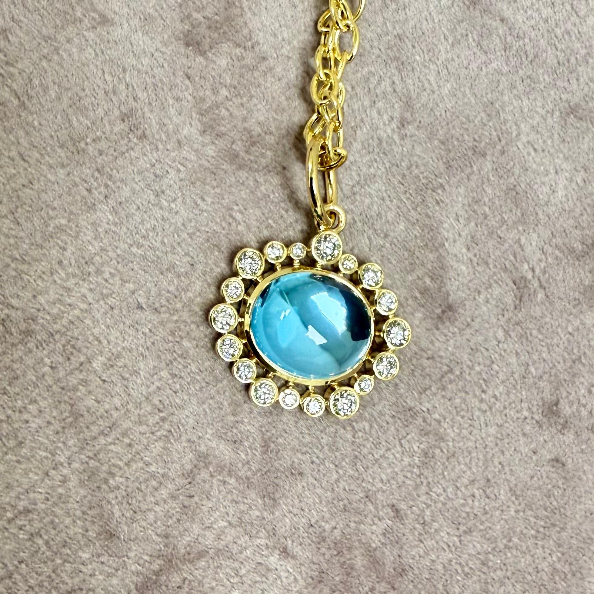 Created in 18 karat yellow gold
Blue Topaz 5 carats approx.
Diamonds 0.40 carat approx.
Chain sold separately

 About the Designers ~ Dharmesh & Namrata

Drawing inspiration from little things, Dharmesh & Namrata Kothari have created an