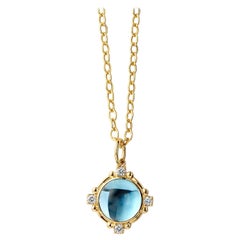 Colgante de oro amarillo Syna de topacio azul con diamantes