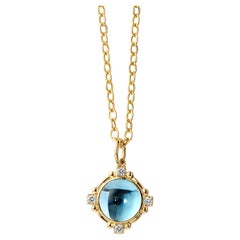 Colgante de oro amarillo Syna de topacio azul con diamantes