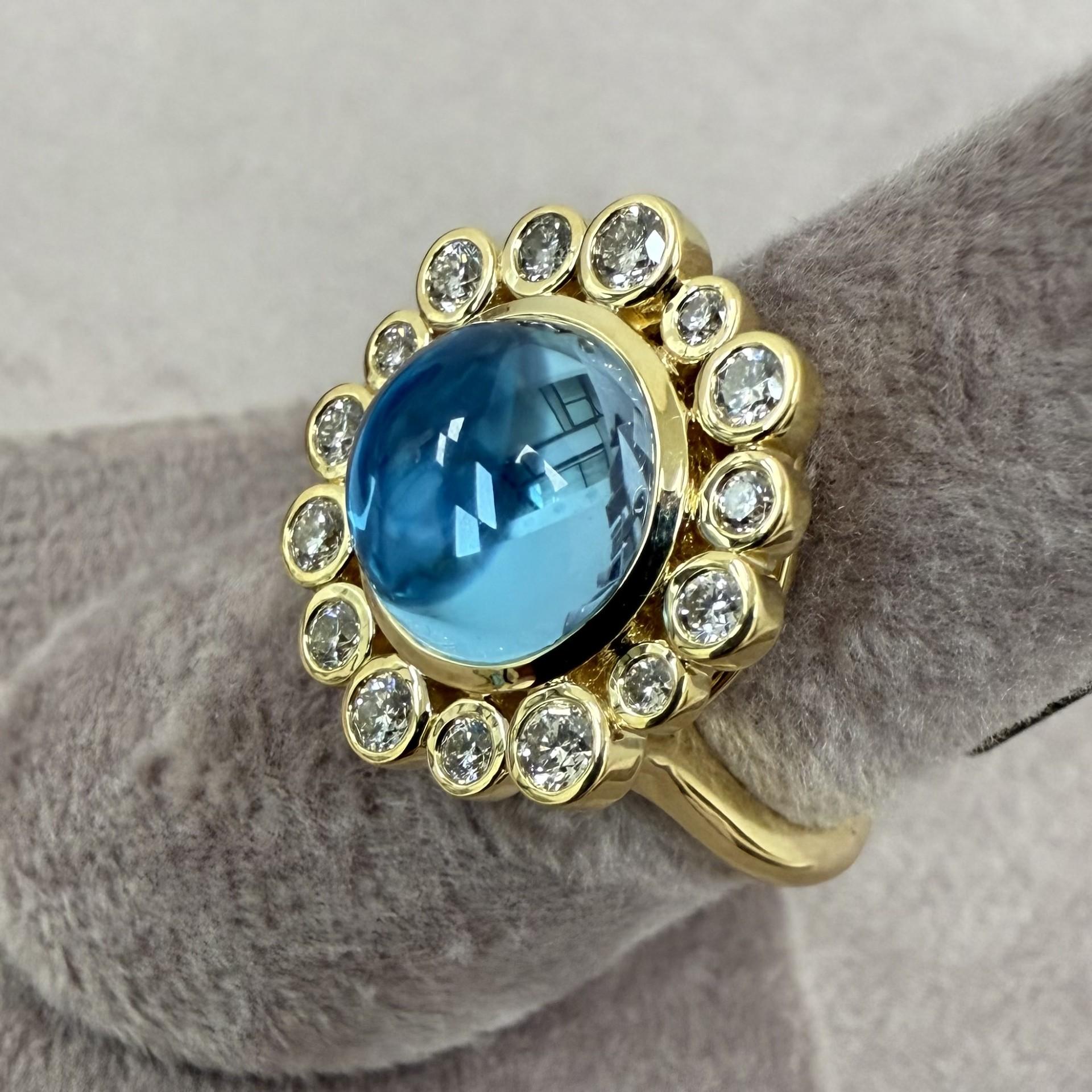 Created in 18 karat yellow gold
Blue Topaz 4.50 carats approx.
Diamonds 0.50 carat approx.
Ring size US 6.5, can be sized
Limited edition

Crafted from 18 karat yellow gold, this limited edition ring is tastefully bejeweled with a 4.50-carat Blue