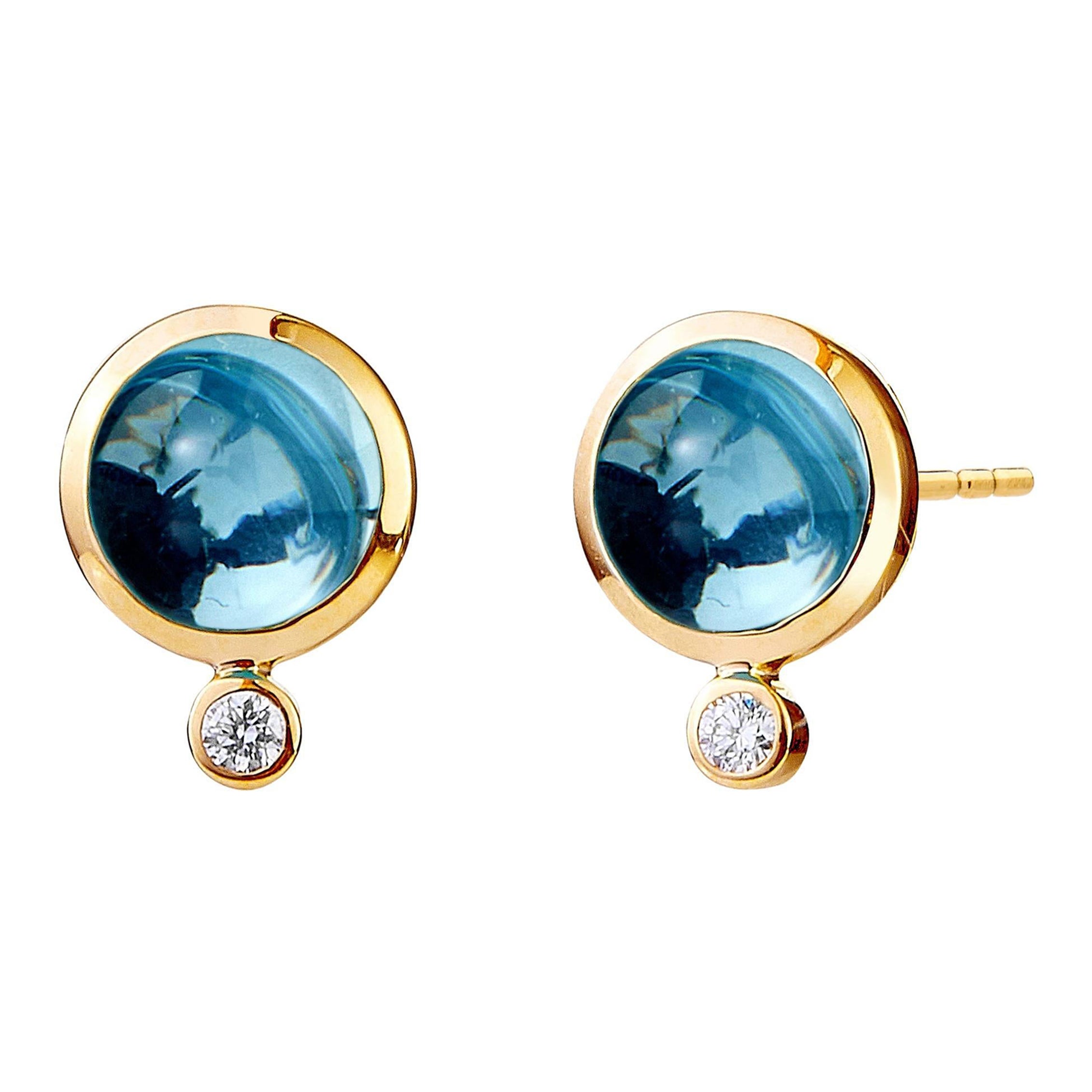 Tachuelas de oro amarillo Syna de topacio azul con diamantes champán