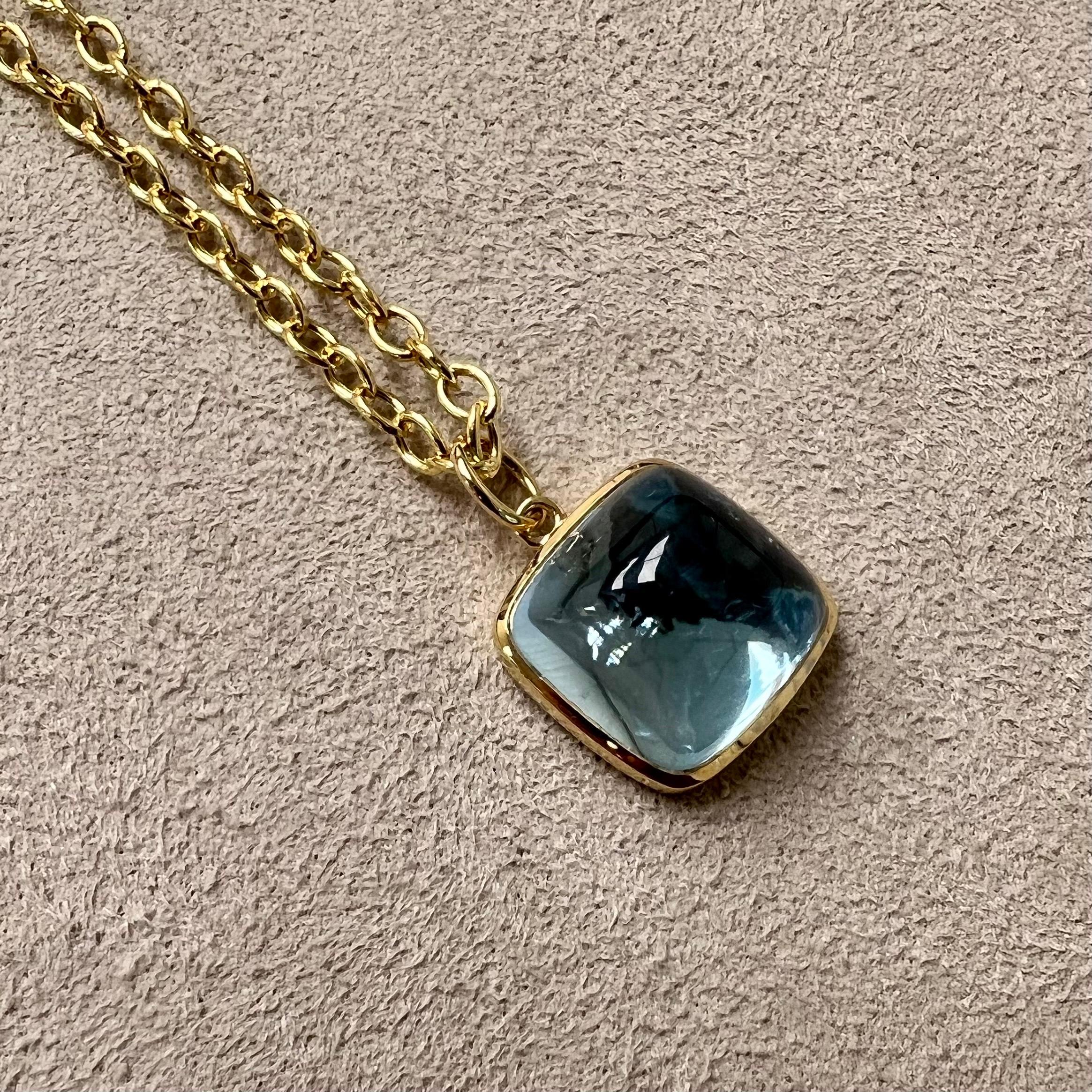 Created in 18 karat yellow gold
Blue topaz 12 carats approx.
Chain sold separately 

Treat yourself to a little sweetness with this Blue Topaz Sugarloaf Pendant! Crafted in 18K yellow gold, it features a 12-carat blue topaz stone for a touch of