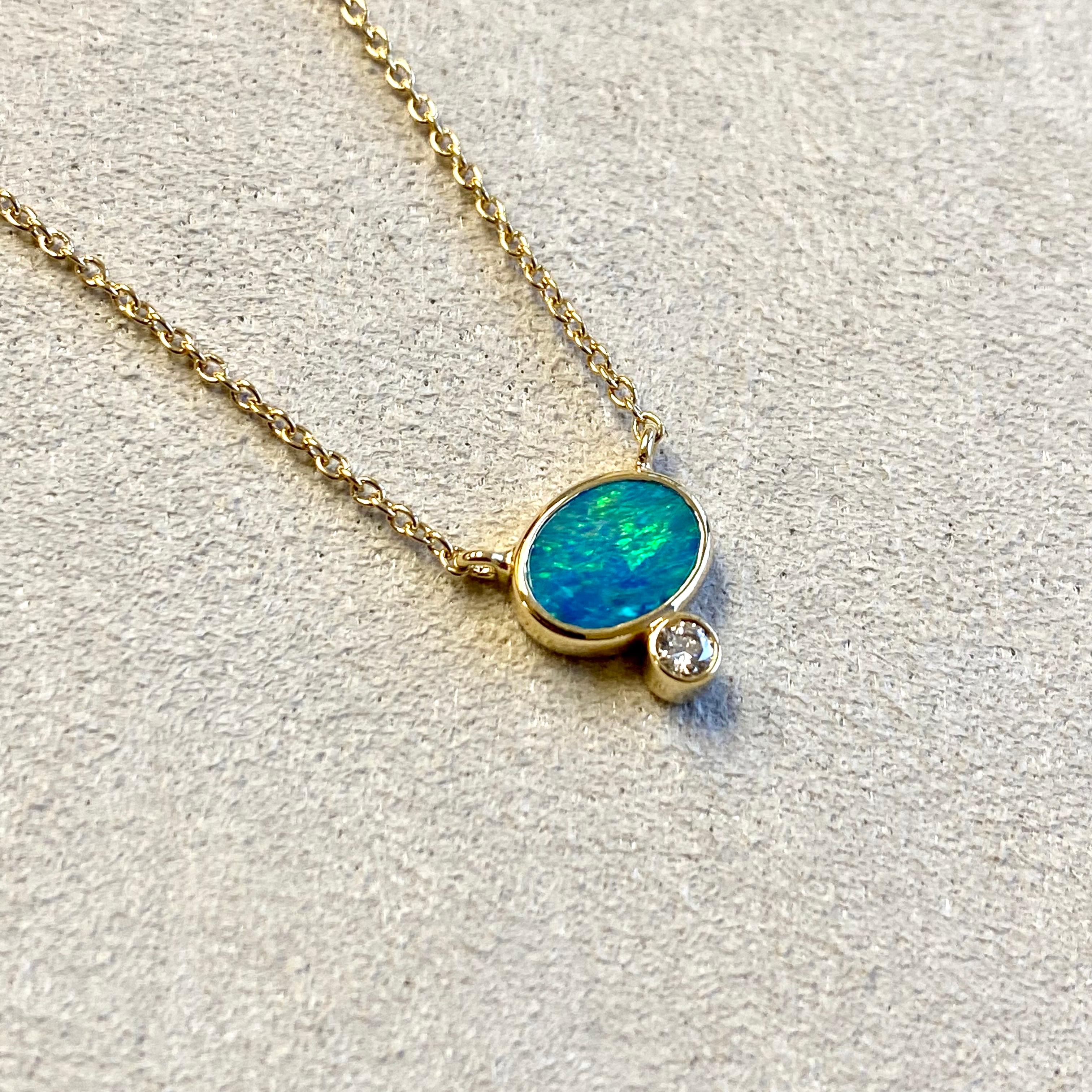 Created in 18 karat yellow gold
Boulder opal 1 carat approx.
Diamond 0.05 carat approx.
18 inch, adjustable at 16-17
Lobster clasp
Limited edition

Exquisite 18 karat yellow gold is the foundation of this limited-edition necklace, punctuated by a
