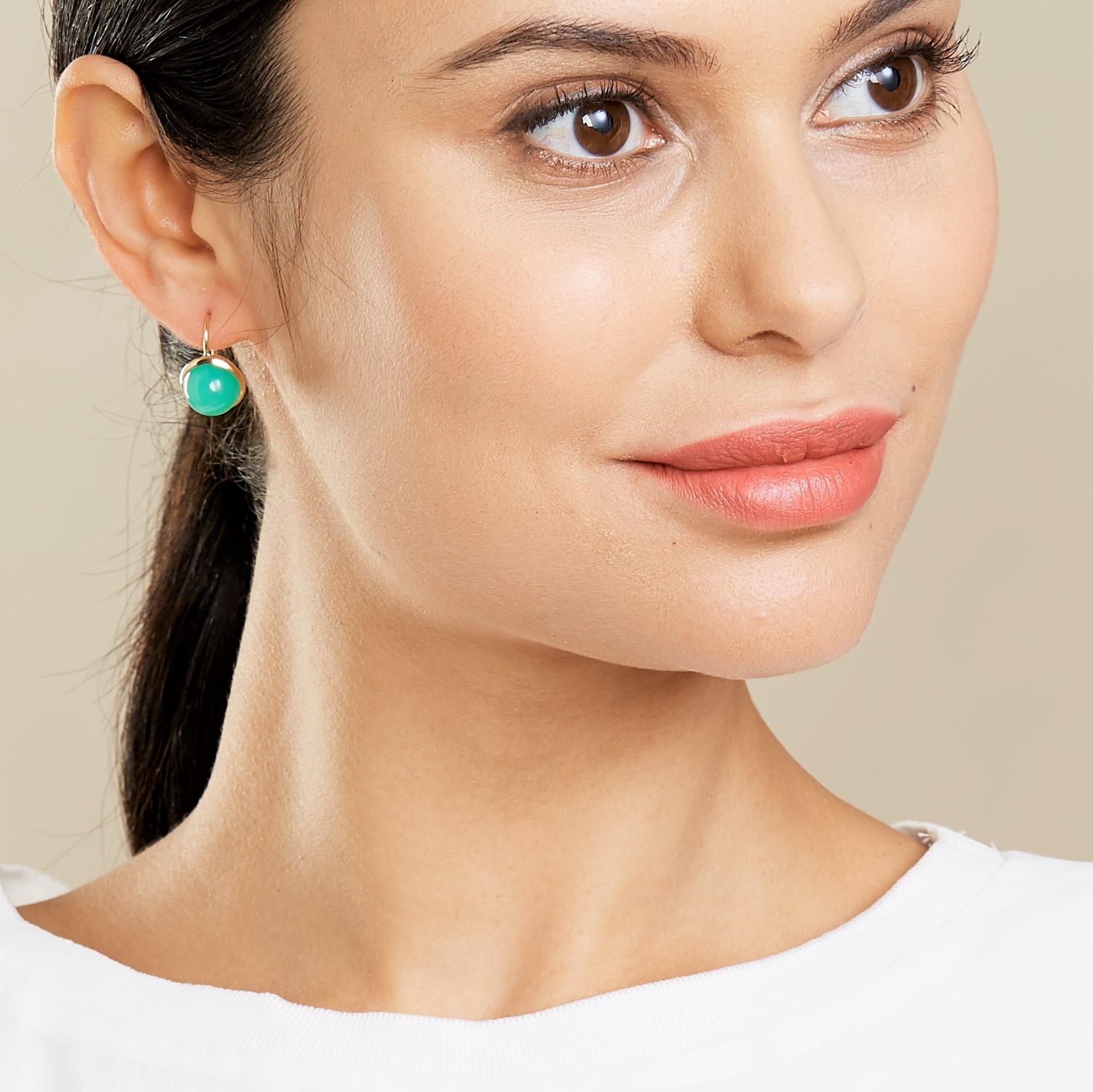 Created in 18kyg
Chrysoprase 15 cts approx

Created with exquisite craftsmanship, these dazzling Candy Blue Topaz and Diamond Earrings bring a luxurious touch to any look. The 18kt yellow gold setting perfectly frames the Chrysoprase, enhancing its