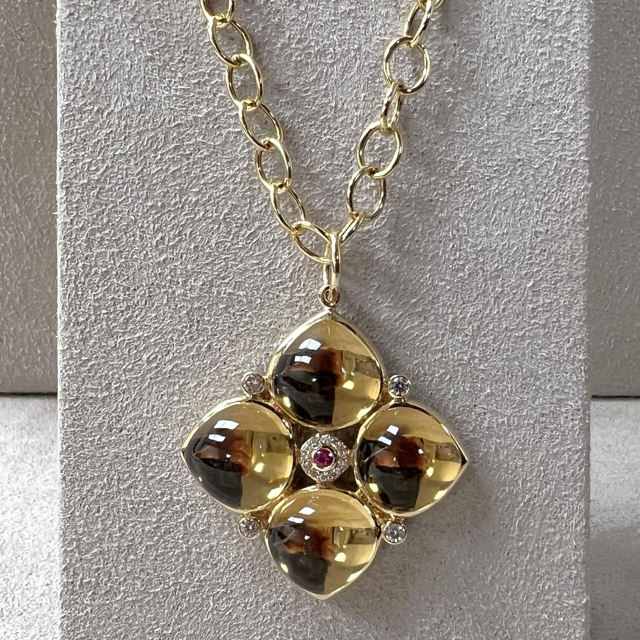Created in 18 karat yellow gold
Citrine 23 carats approx.
Ruby 0.05 carat approx.
Diamonds 0.20 carat approx.
Chain sold separately 
Limited edition

Crafted from 18k yellow gold and adorned with 23 carats of Citrine, a 0.05 carat Ruby, and 0.20