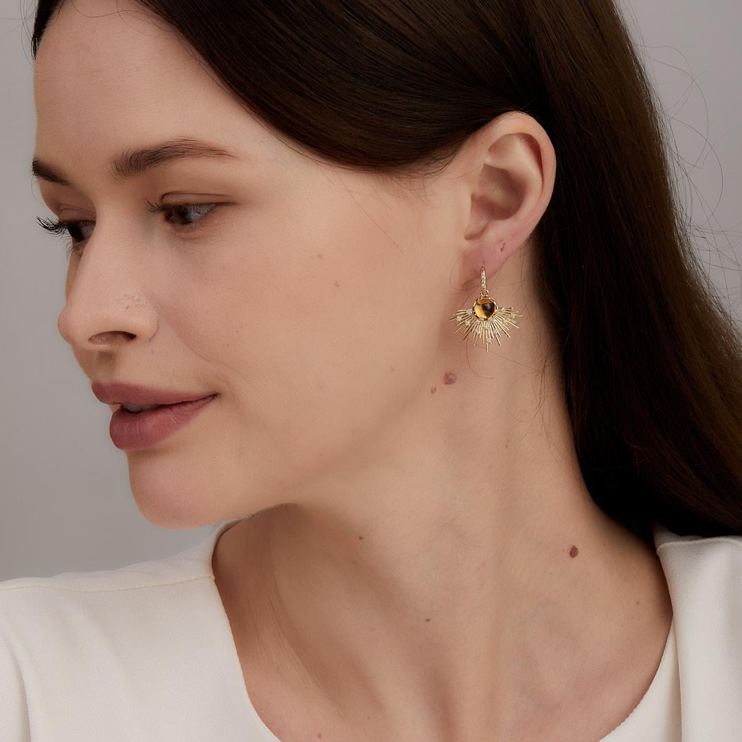 Created in 18 karat yellow gold
Citrine 2.50 carats approx.
Diamonds 0.15 carat approx.
French wire for pierced ears
Limited Edition

Experience the luxury of the Cosmic Gemstones Earrings. Crafted from 18 karat yellow gold, these limited edition