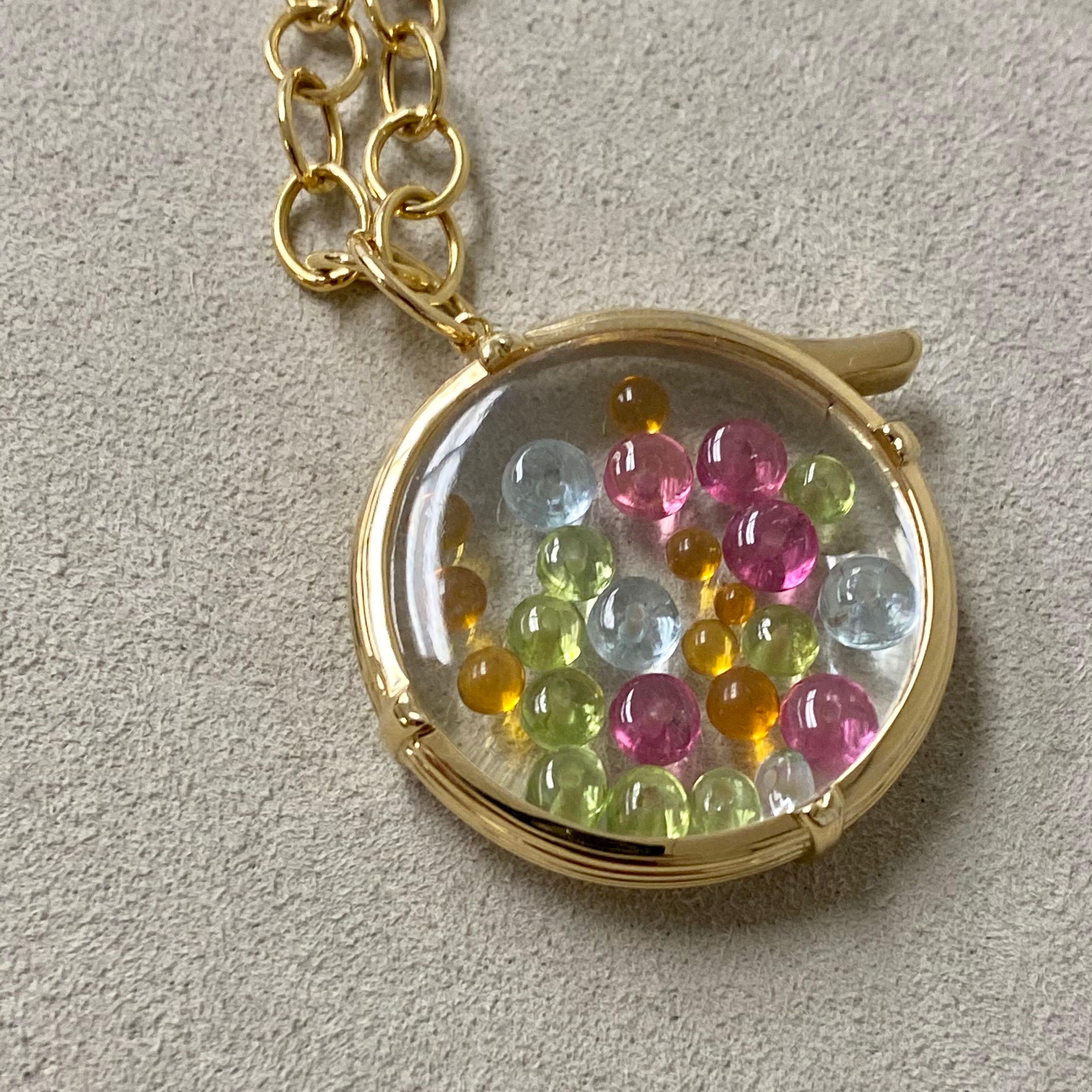 Created in 18 karat yellow gold 
Crystal plates 21 carats approx.
Multi color gemstone beads
Openable and reversible locket
Chain sold separately
Limited Edition

About the Designers ~ Dharmesh & Namrata

Drawing inspiration from little things,