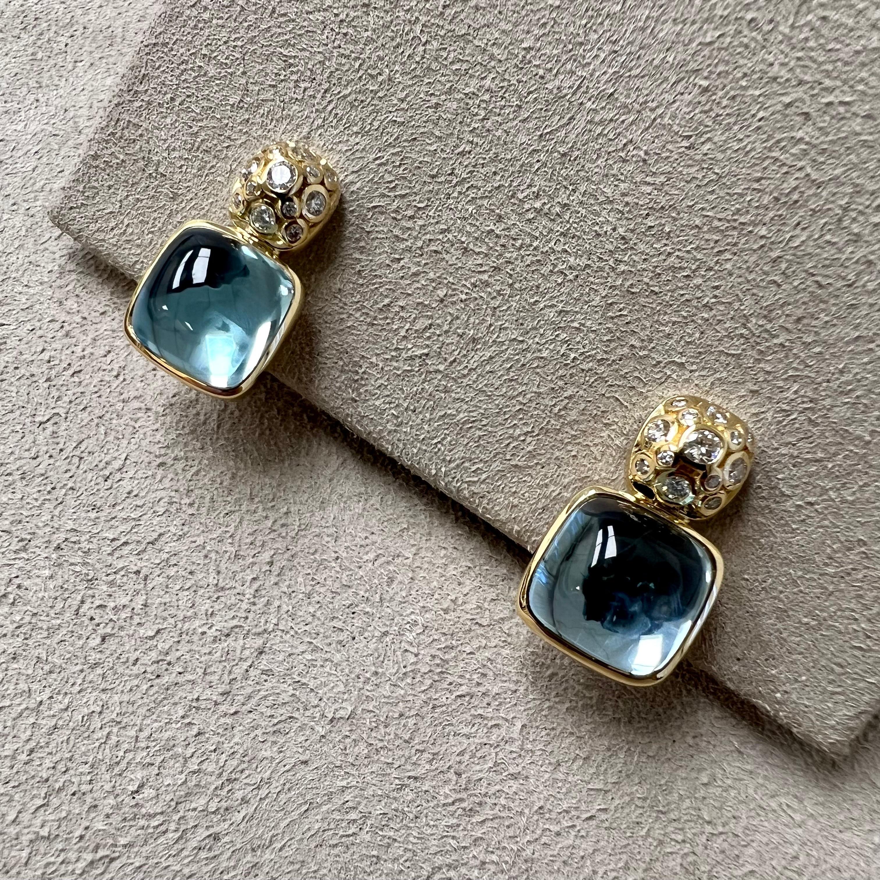 Created in 18kyg
Blue Topaz 15 carats approx.
Diamonds 0.30 carat approx.
Omega clip backs
Limited edition

Crafted from 18-karat yellow gold, these exquisite earrings boast a shimmering 15-carat blue topaz and dazzling 0.30-carat diamonds. Adorned