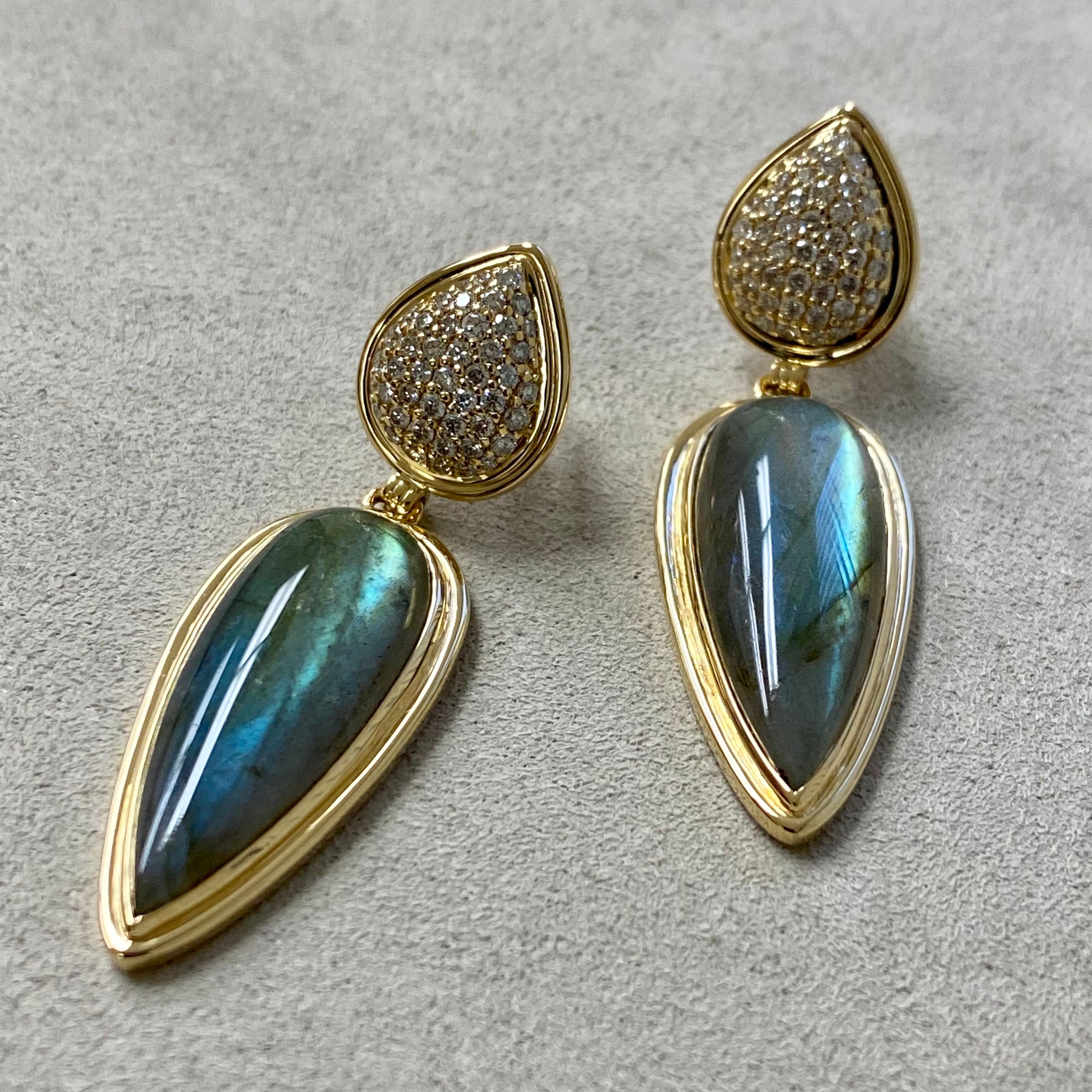Created in 18 karat yellow gold
Labradorite 18 carats approx.
Diamonds 0.70 carat approx.
18kyg post backs for pierced ears

Exquisitely forged in 18 karat yellow gold and featuring labradorite totaling 18 carats and 0.70 carats of diamonds, these