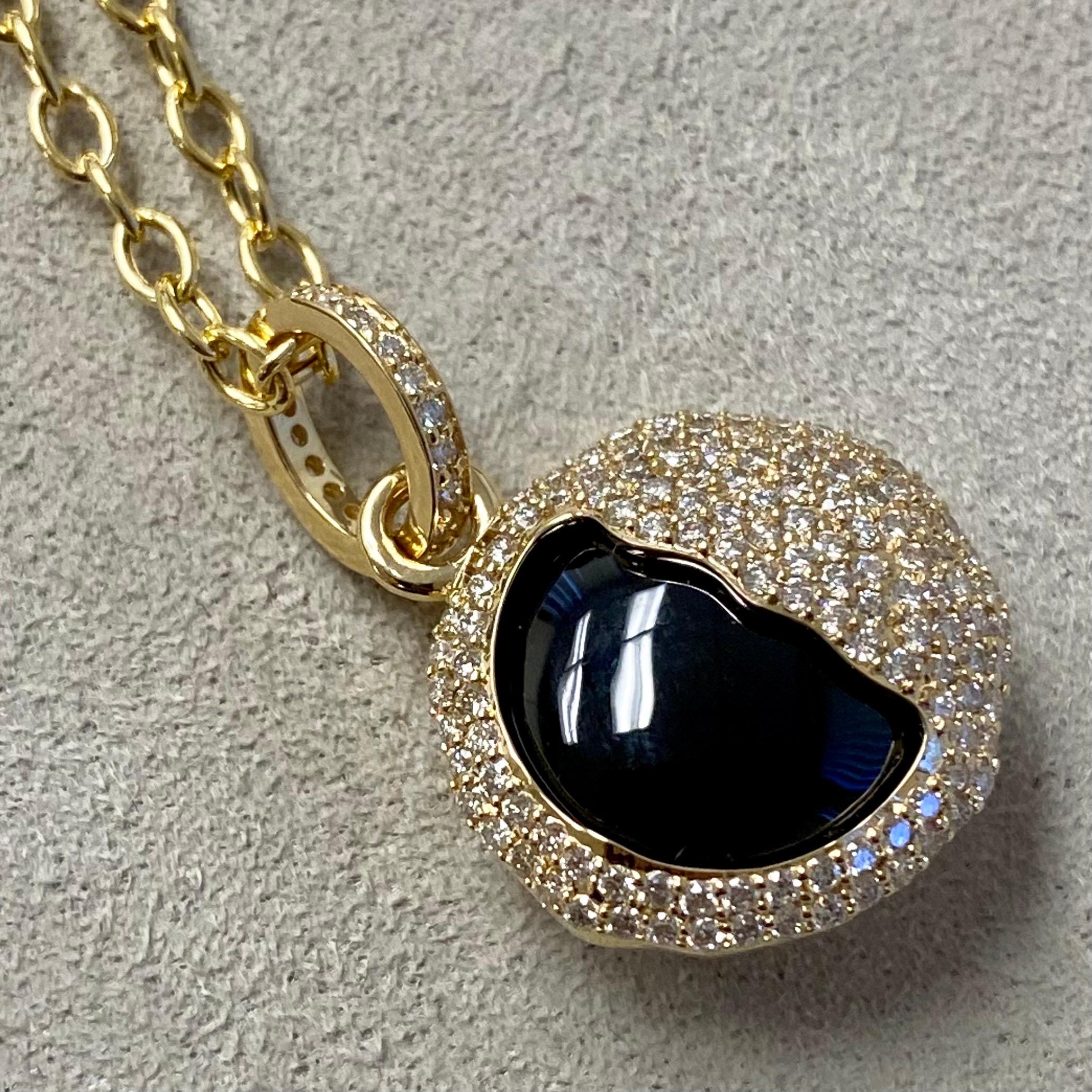 Created in 18 karat yellow gold
Black Onyx 13 carats approx.
Diamonds 0.80 carat approx.
Chain sold separately
One of a kind

Expertly cast from 18 carat yellow gold, this singular piece showcases a glittering diamond totalling 0.80 carats
