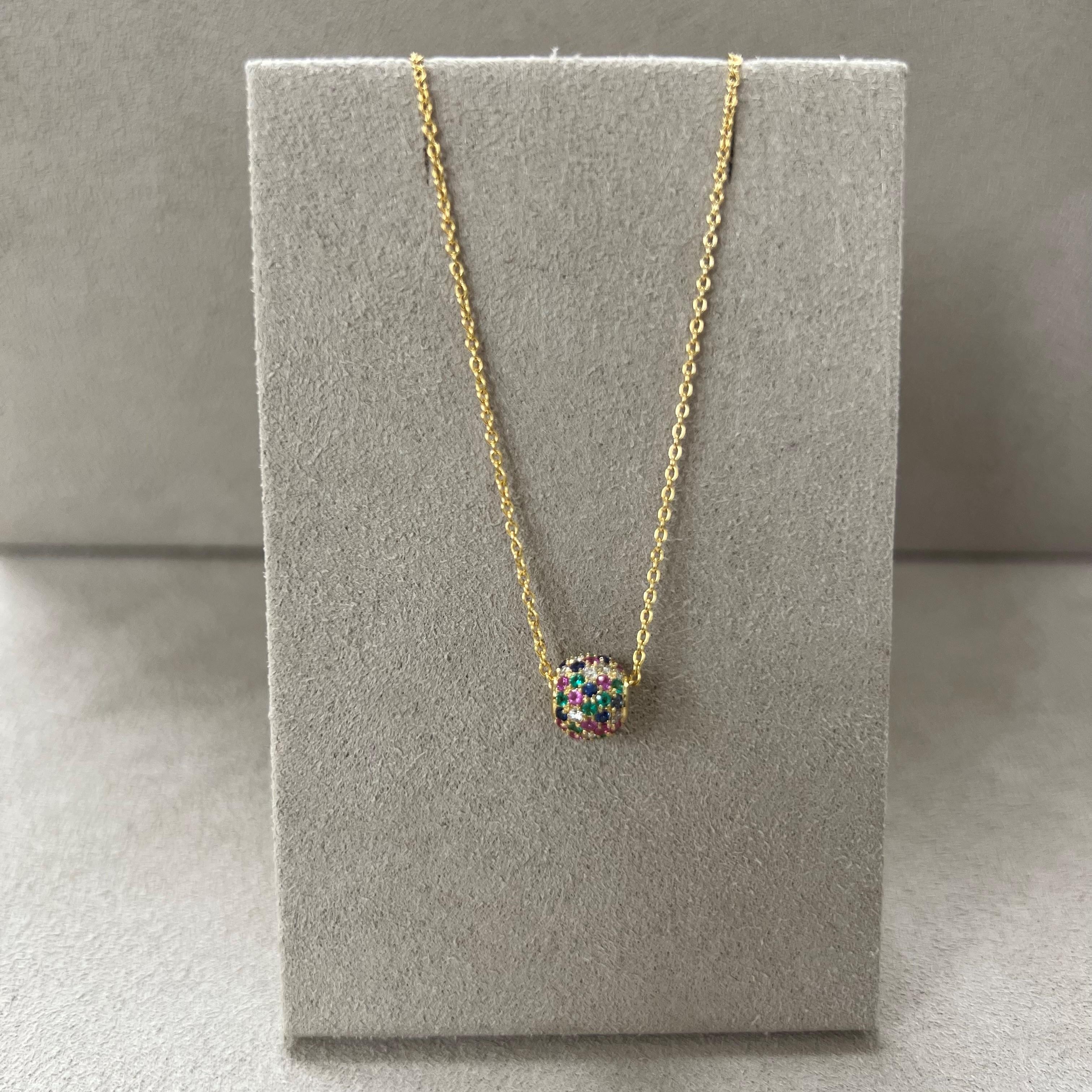 Created in 18 karat yellow gold
Emerald 0.10 carat approx.
Multi color Sapphires 0.40 carat approx.
Diamonds 0.15 carat approx.
18kyg 18 inch chain with 18kyg lobster lock
The chain can be worn at 17 & 16 inches as well



About the Designers ~