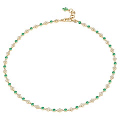 Syna Blumenhalskette aus Gelbgold mit Smaragden und Diamanten