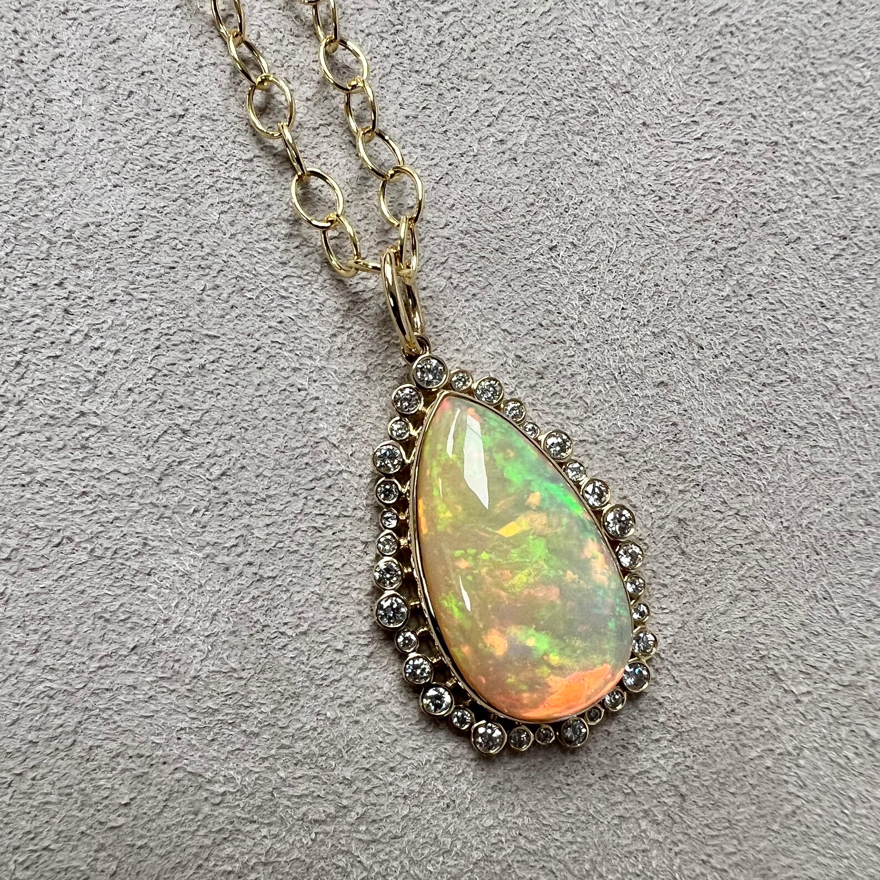 Created in 18 karat yellow gold
Ethiopian opal 8.50 carats approx.
Diamonds 0.50 carat approx.
Chain sold separately

Crafted with 18 karat yellow gold, this Pendant features 8.50 carats of Ethiopian opal and 0.50 carats of diamonds. Please note