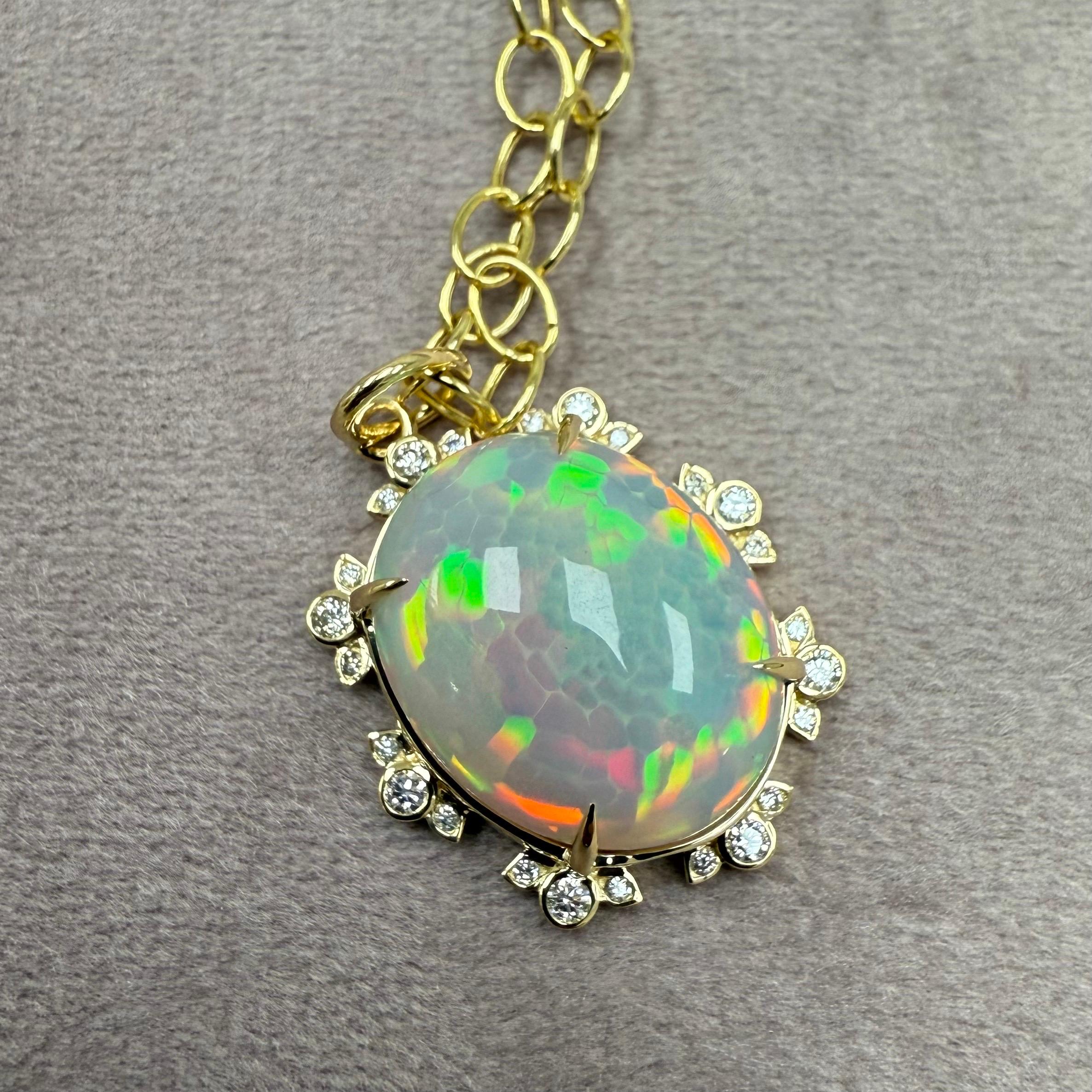 Created in 18 karat yellow gold
Ethiopian Opal 10 carats approx.
Diamonds 0.25 carats approx.
Chain sold separately

 About the Designers ~ Dharmesh & Namrata

Drawing inspiration from little things, Dharmesh & Namrata Kothari have created an