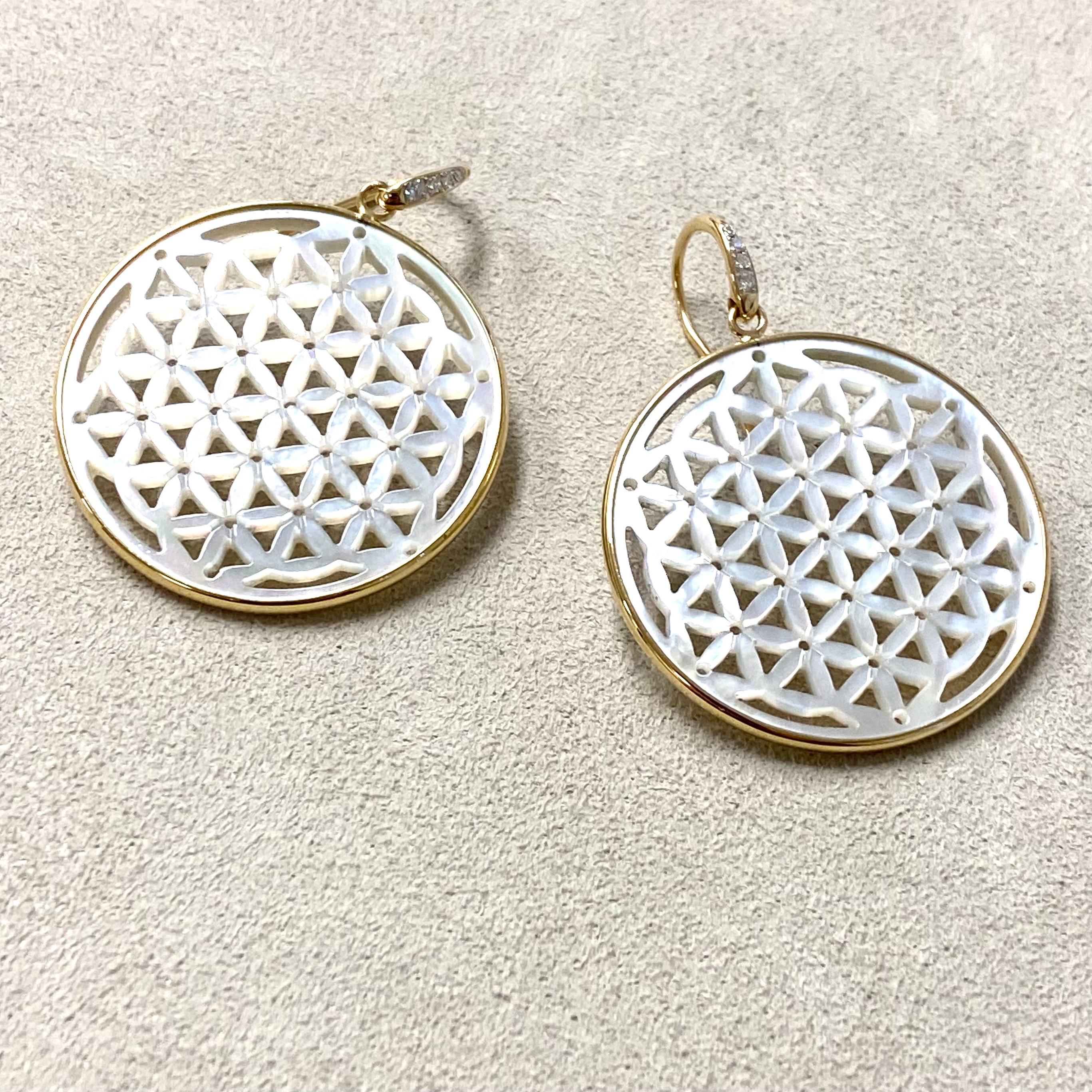 Created in 18 karat yellow gold
Flower of life motif
Diamonds 0.05 carat approx.
Limited edition

Gorgeous and one of a kind, these limited edition 18 karat yellow gold earrings boast a sophisticated Candy Blue Topaz and shimmering Moon Quartz set