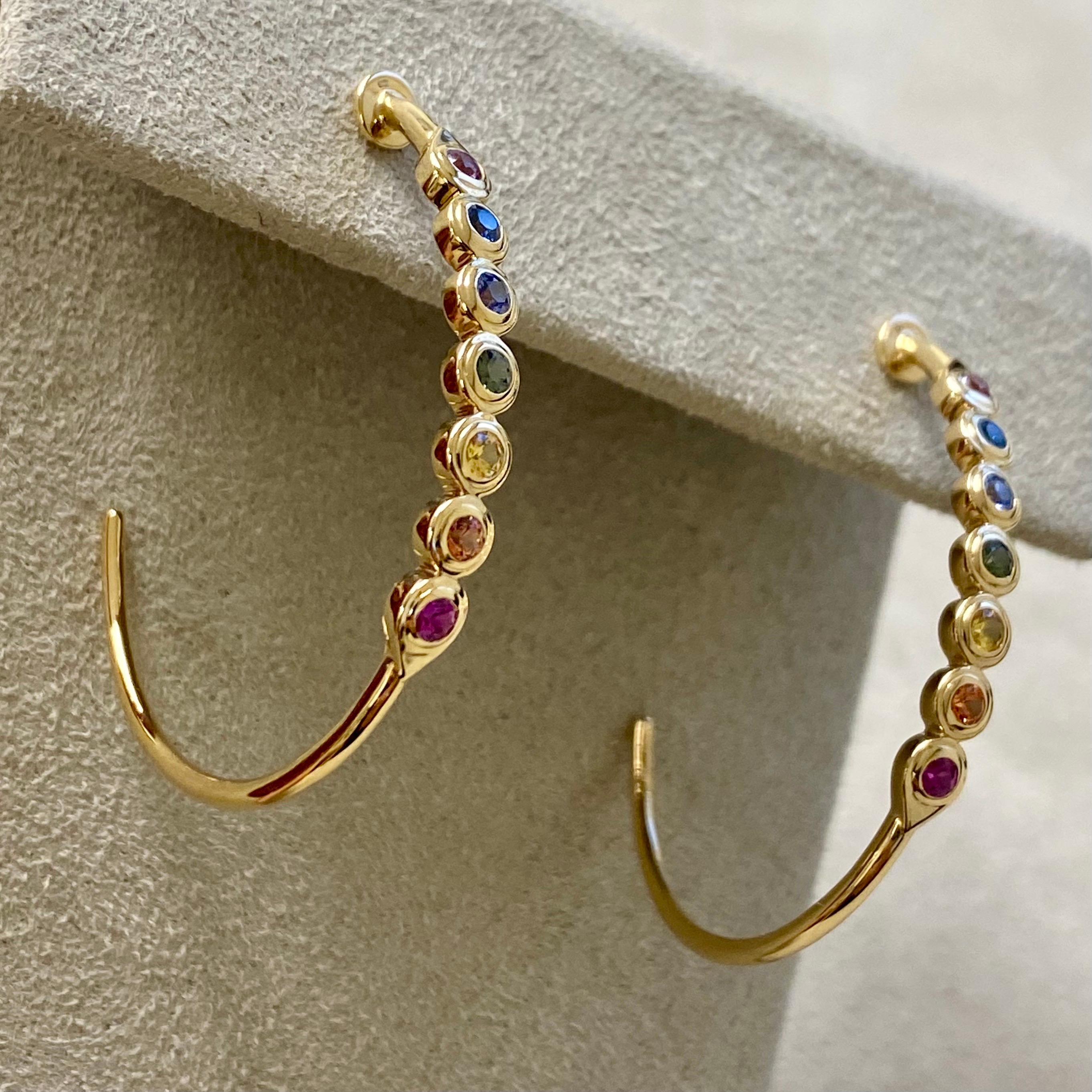 Created in 18 karat yellow gold
Rainbow sapphires 0.80 carat approx.
18 karat yellow gold butterfly backs

Expertly molded from 18-karat yellow gold, these earrings showcase stunning rainbow sapphires, weighing in around 0.80 carats, and secure with