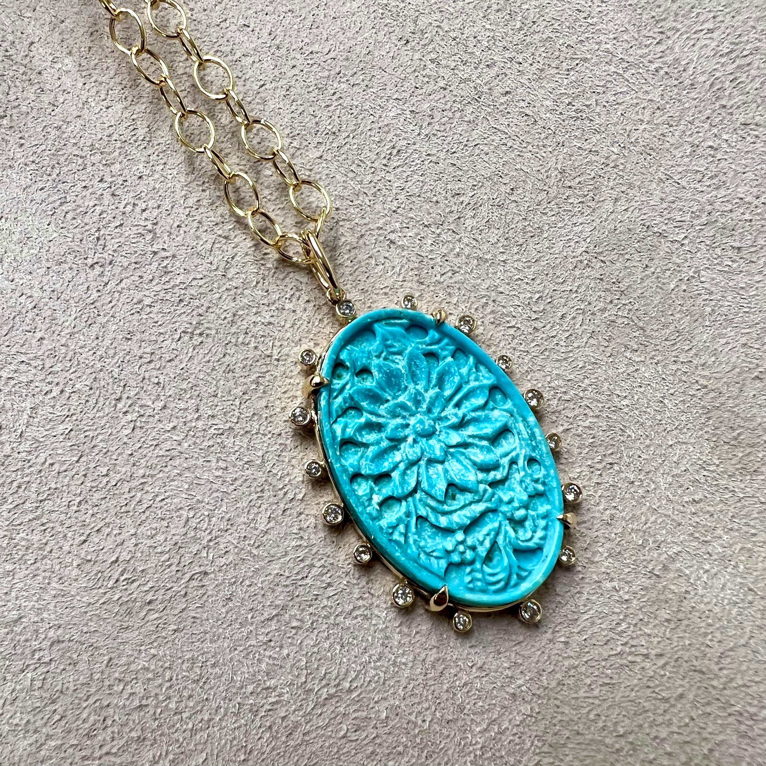 Created in 18 karat yellow gold
Turquoise 11 carats approx.
Diamonds 0.18 carat approx.
Chain sold separately

Formed in 18-karat golden yellow, Turquoise 11 carats approx., and Diamonds 0.18 carats approx., this pendant is an exquisite addition to