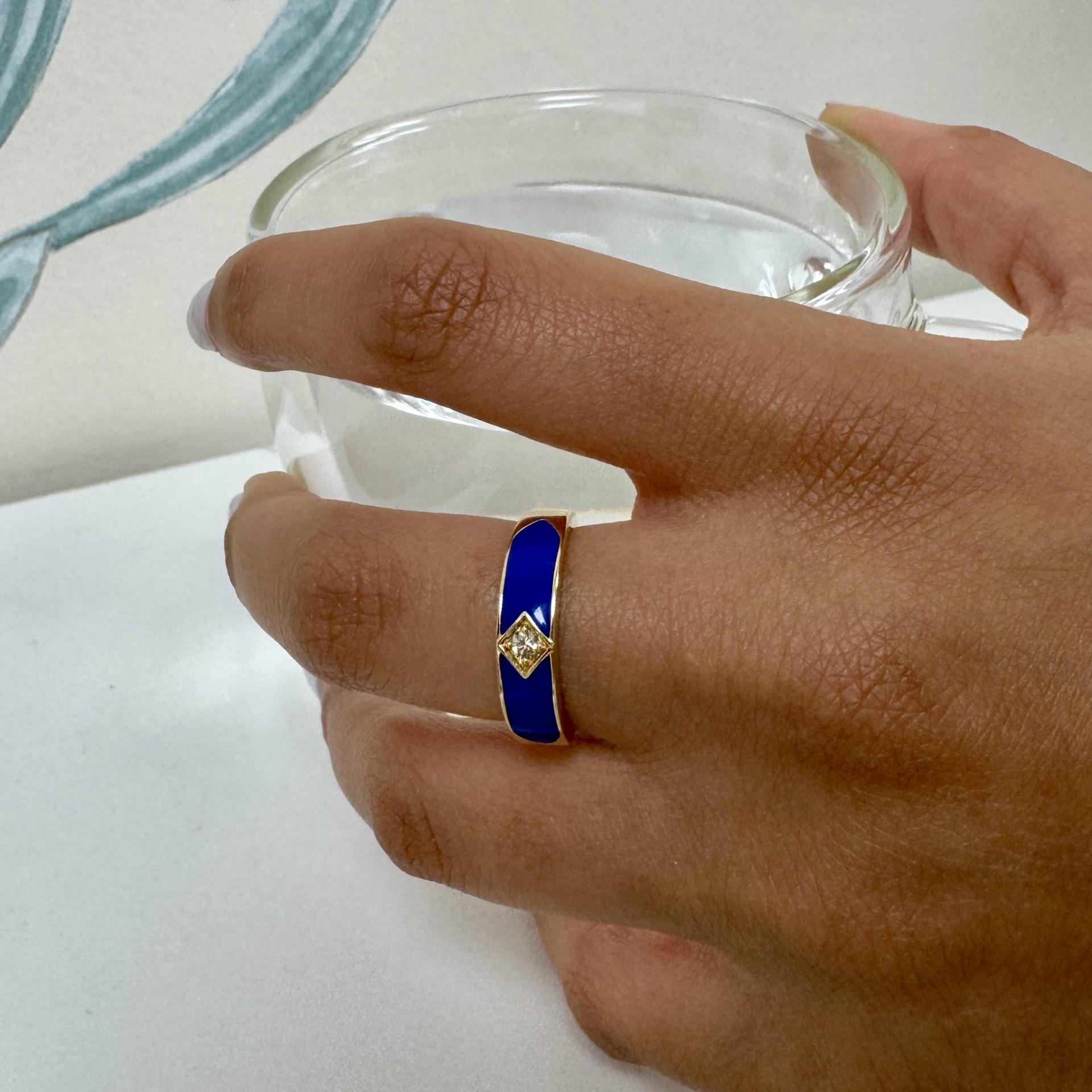 Created in 18 karat yellow gold
Diamond 0.06 carat approx.
Lapis blue enamel 
Ring size US 6.5, Can be made in other ring sizes on special order
Limited edition

Shimmering with 18 karat yellow gold, this limited edition piece showcases a 0.06 carat