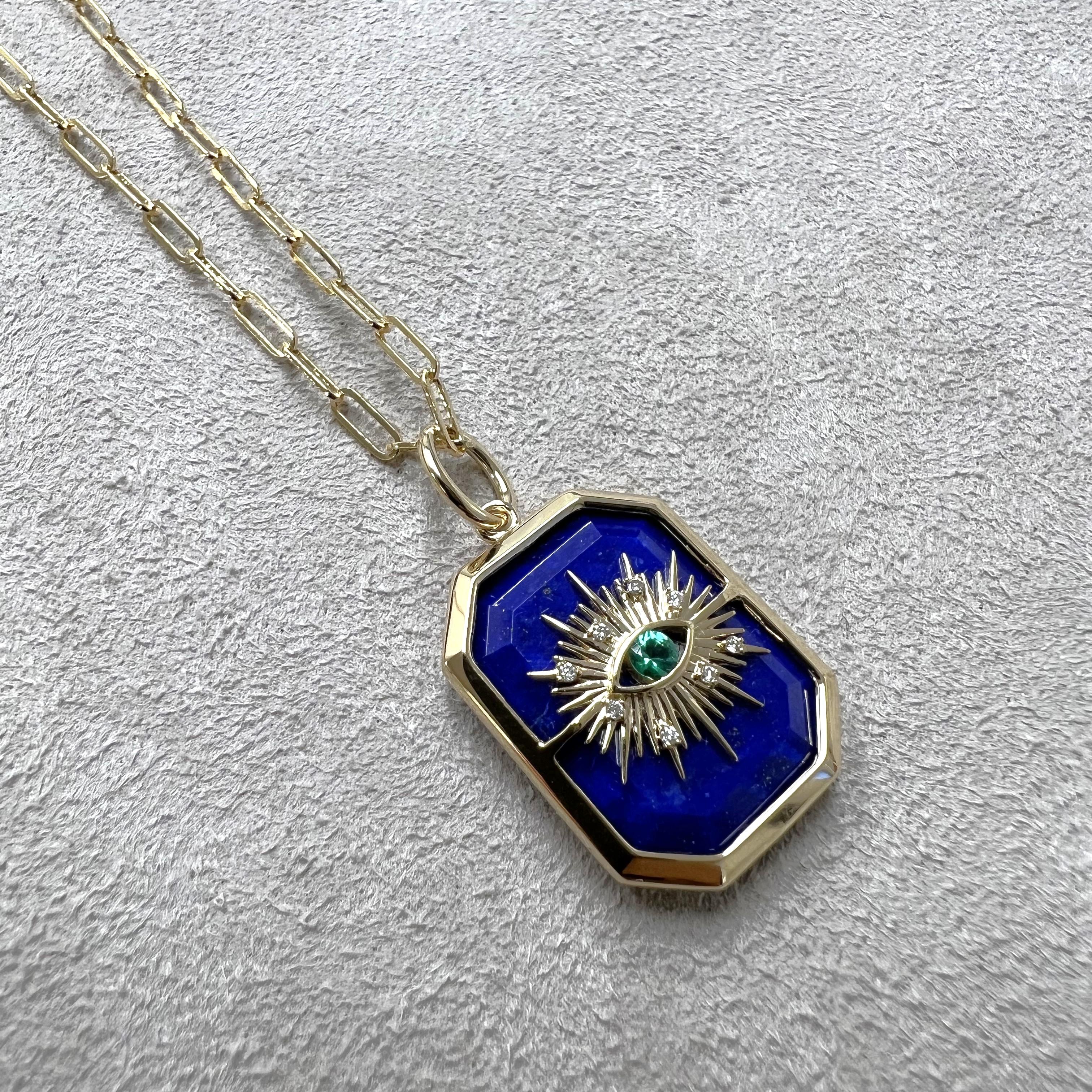 Created in 18 karat yellow gold
Lapis Lazuli 13 carats approx.
Emerald 0.07 carat approx.
Diamonds 0.03 carat approx.
Chain sold separately
Limited Edition

Crafted from 18 karat yellow gold, this luxurious limited-edition pendant features an