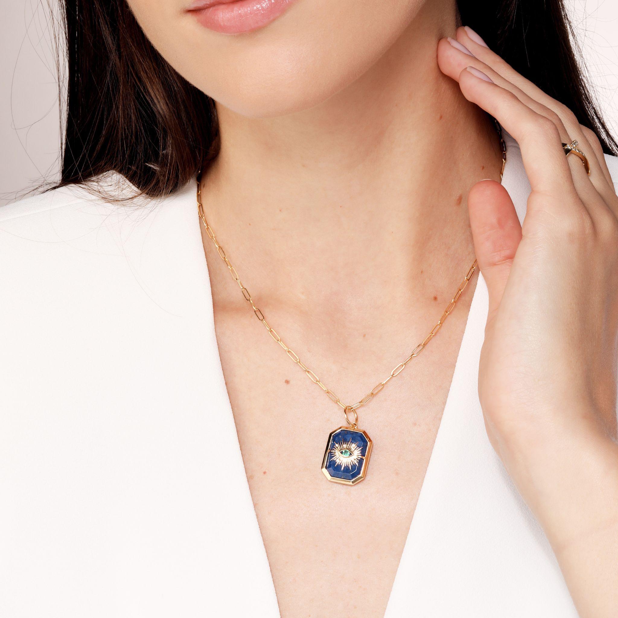Created in 18 karat yellow gold
Lapis Lazuli 13 carats approx.
Emerald 0.07 carat approx.
Diamonds 0.03 carat approx.
Chain sold separately
Limited Edition

Crafted from 18 karat yellow gold, this luxurious limited-edition pendant features an