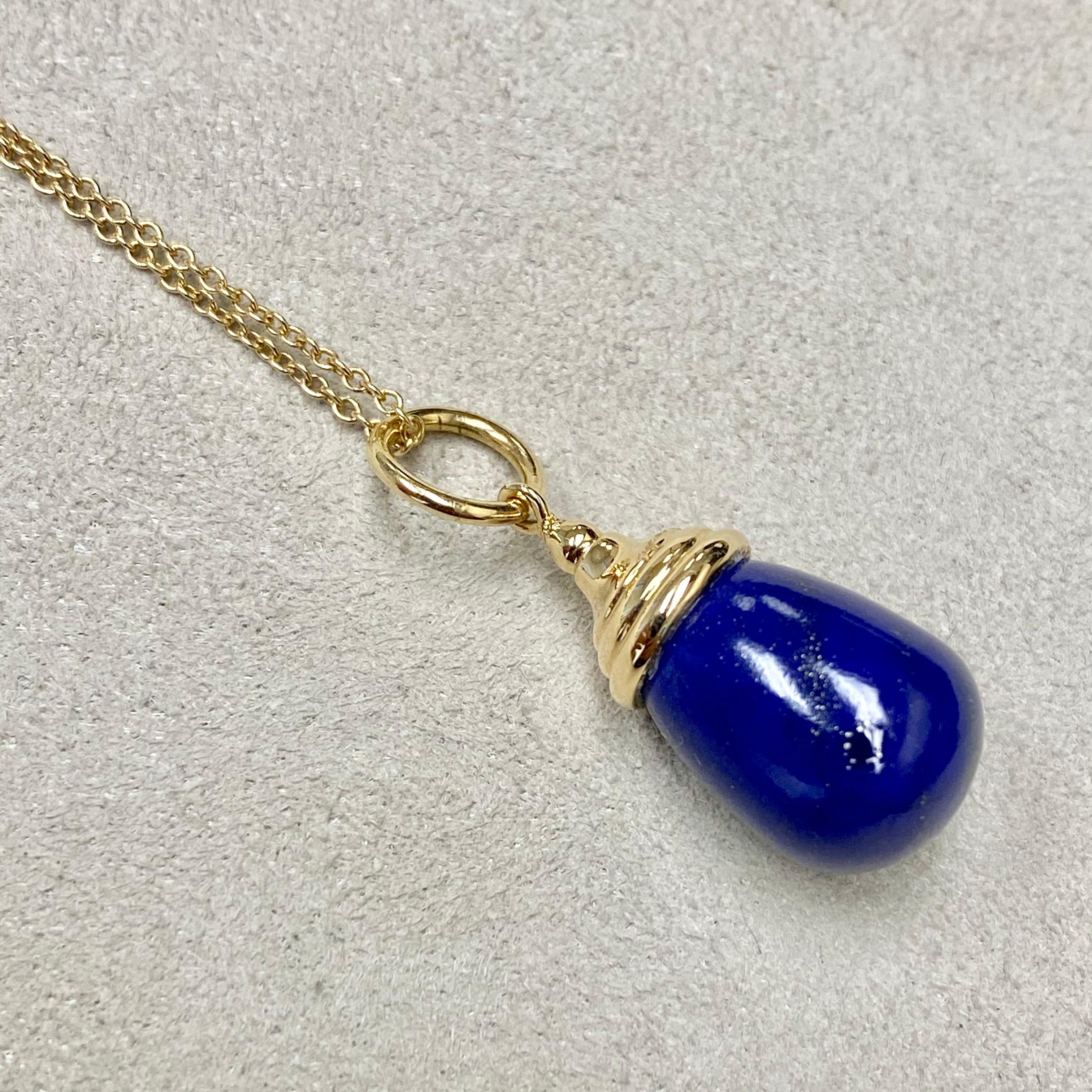Created in 18 karat yellow gold 
Lapis Lazuli 12 cts approx
Chain sold separately

Crafted from lustrous 18 karat yellow gold, this impressive pendant showcases an impressive Lapis Lazuli, estimated at 12 carats, with a chain sold separately.

About