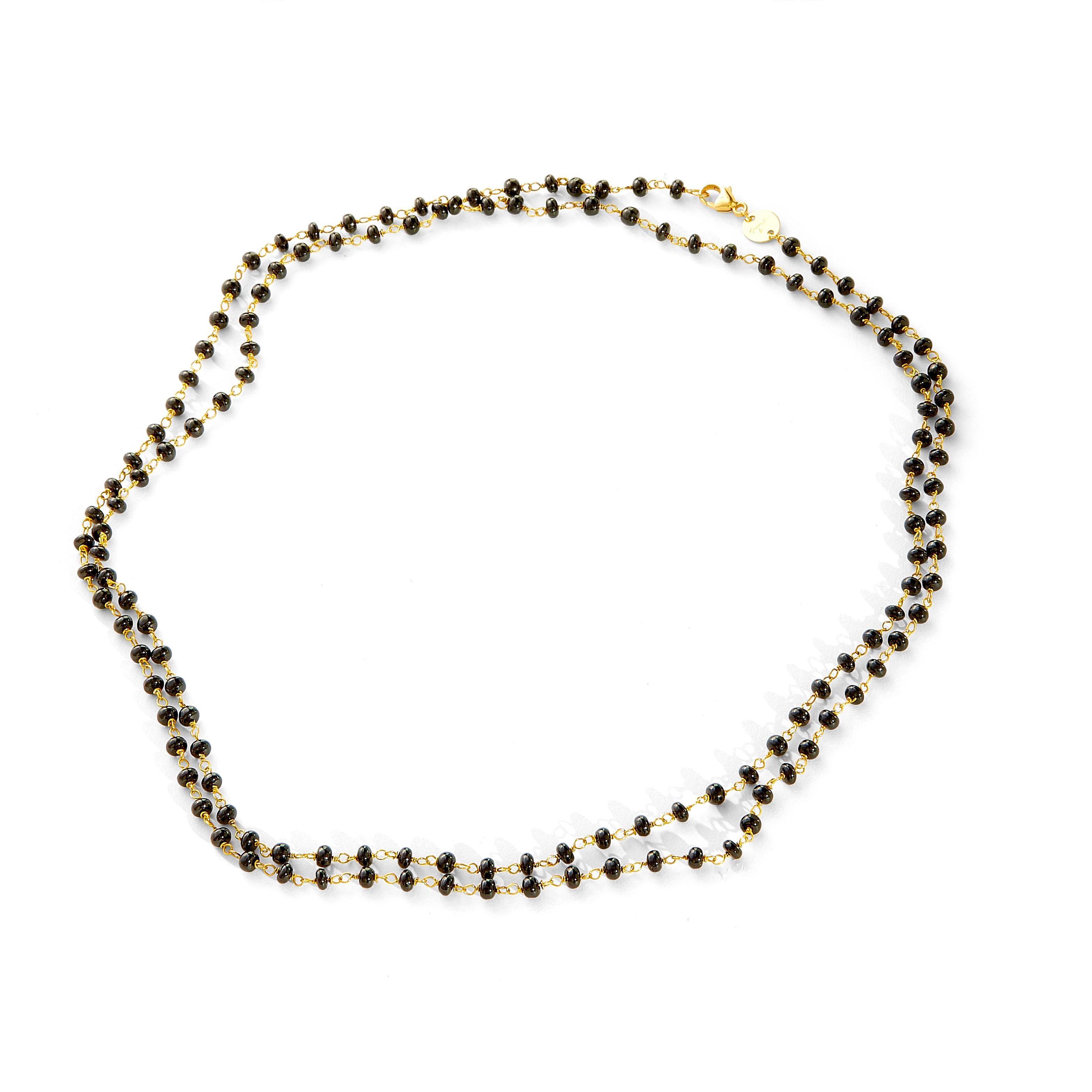 Created in 18 karat yellow gold
36 inch length
Black spinel beads
18kyg lobster clasp
Limited edition

Exquisitely crafted from 18 karat yellow gold, this limited edition necklace showcases a 36 inch length, featuring black spinel beads and a
