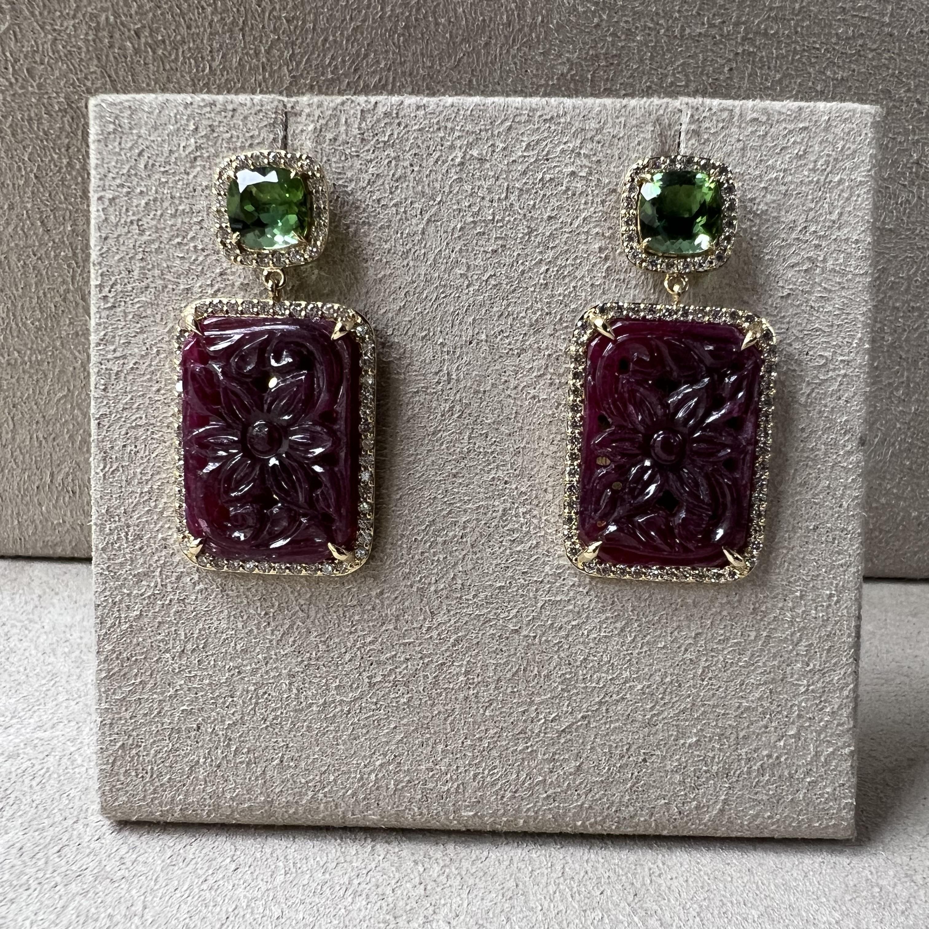 18 karat yellow gold
Green Tourmaline 3 carats approx.
Carved Rubies 23 carats approx.
Diamonds 1.10 carats approx.
18 kyg butterfly backs
Limited edition

About the Designers ~ Dharmesh & Namrata

Drawing inspiration from little things, Dharmesh &