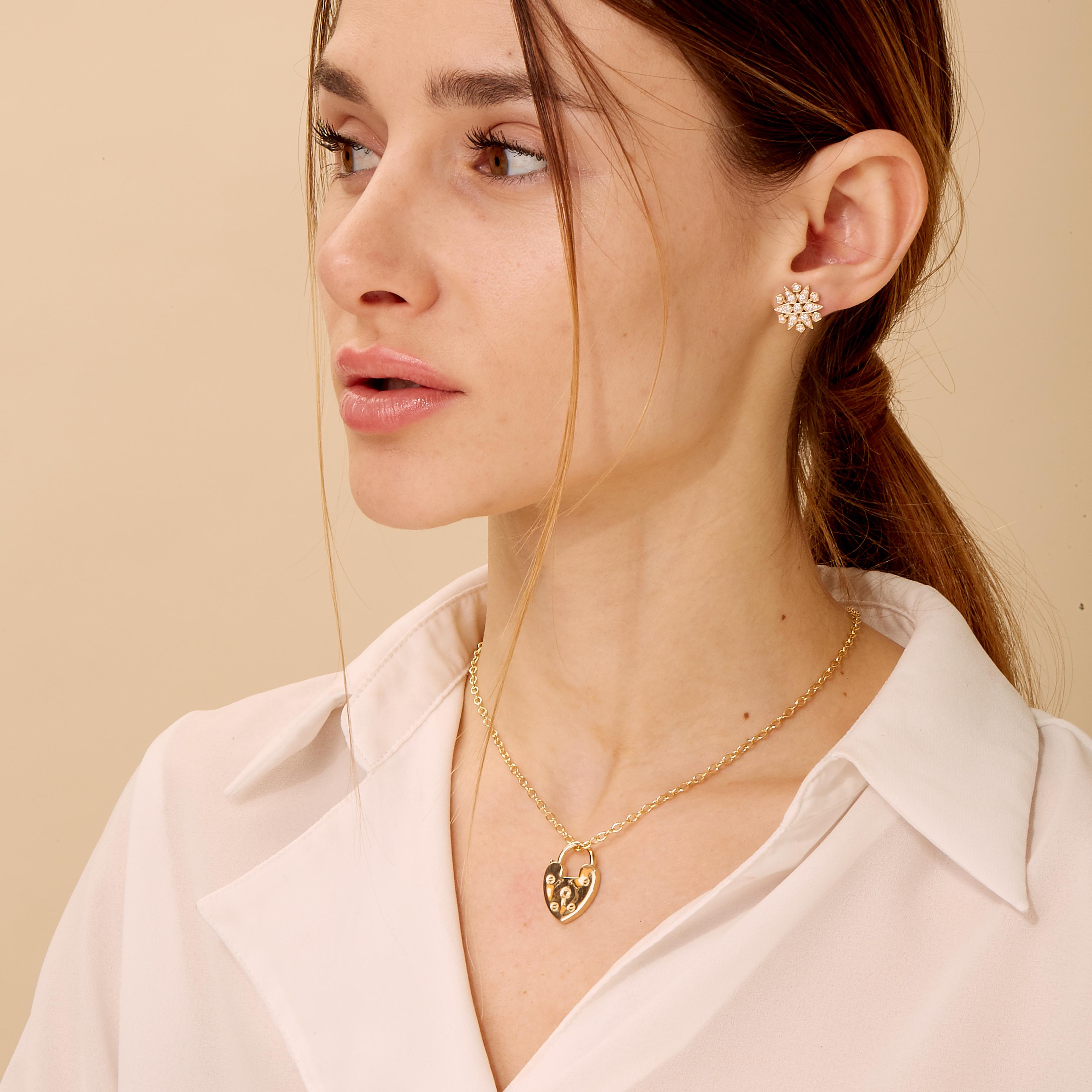 Created in 18 karat yellow gold
Openable lock
Limited edition
Chain sold separately

Cast in 18 karat yellow gold, this limited edition pendant features an openable lock, and a chain must be purchased separately.

 About the Designers ~ Dharmesh &