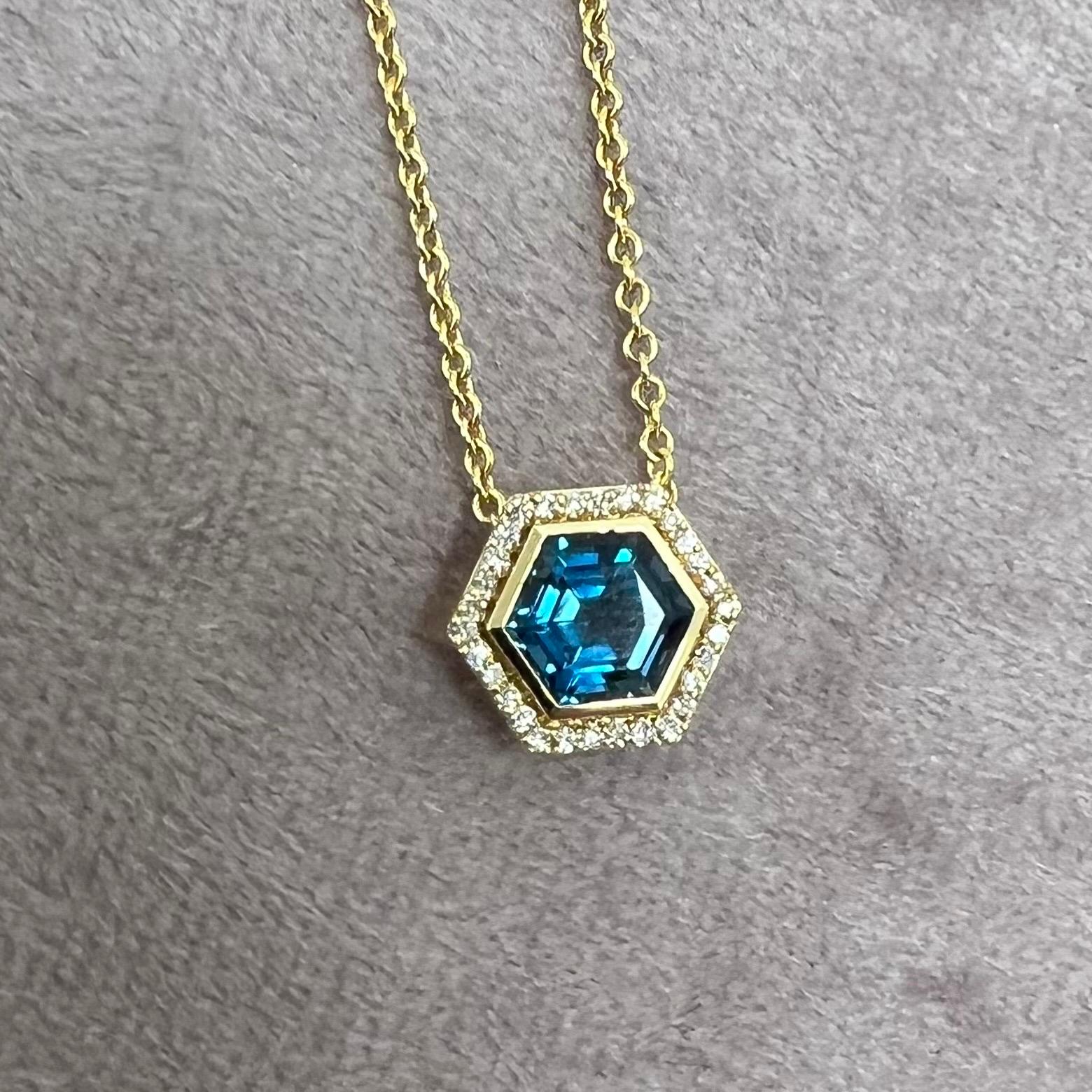 Created in 18 karat yellow gold
London blue topaz 1.50 carats approx.
Diamonds 0.15 carat approx.
18 inch, adjustable at 16-17
Limited edition

Exquisitely crafted from 18 karat yellow gold, this limited edition pendant features a stunning London