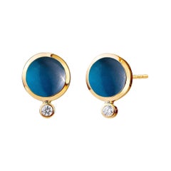 Tachuelas de oro amarillo Syna con topacio azul de Londres y diamantes