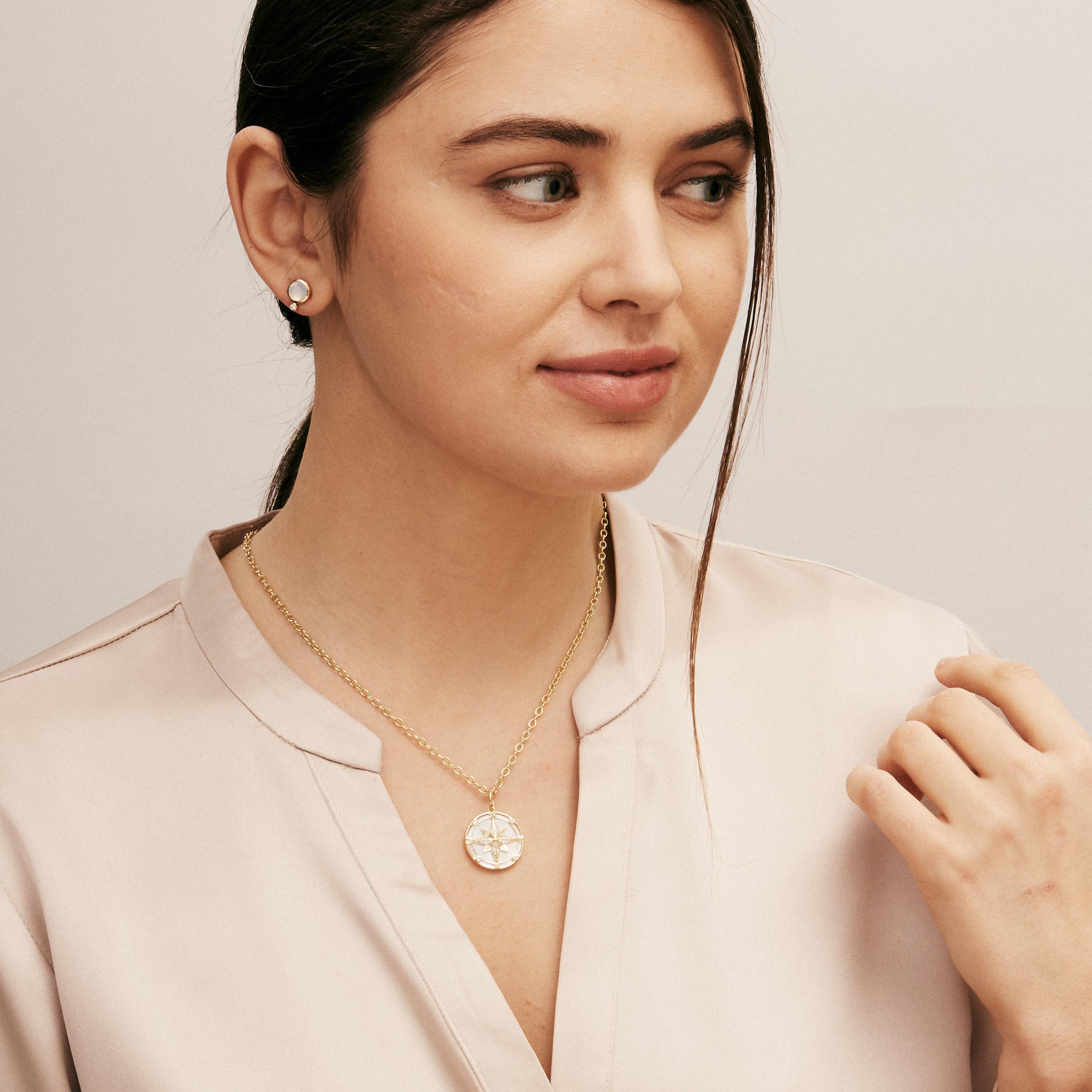 Created in 18 karat yellow gold
Mother of pearl 4.20 carats approx.
Diamonds 0.20 carat approx.
Chain sold separately 
Limited edition

Handcrafted from 18 karat yellow gold, this luxurious pendant features an intricately carved mother of pearl