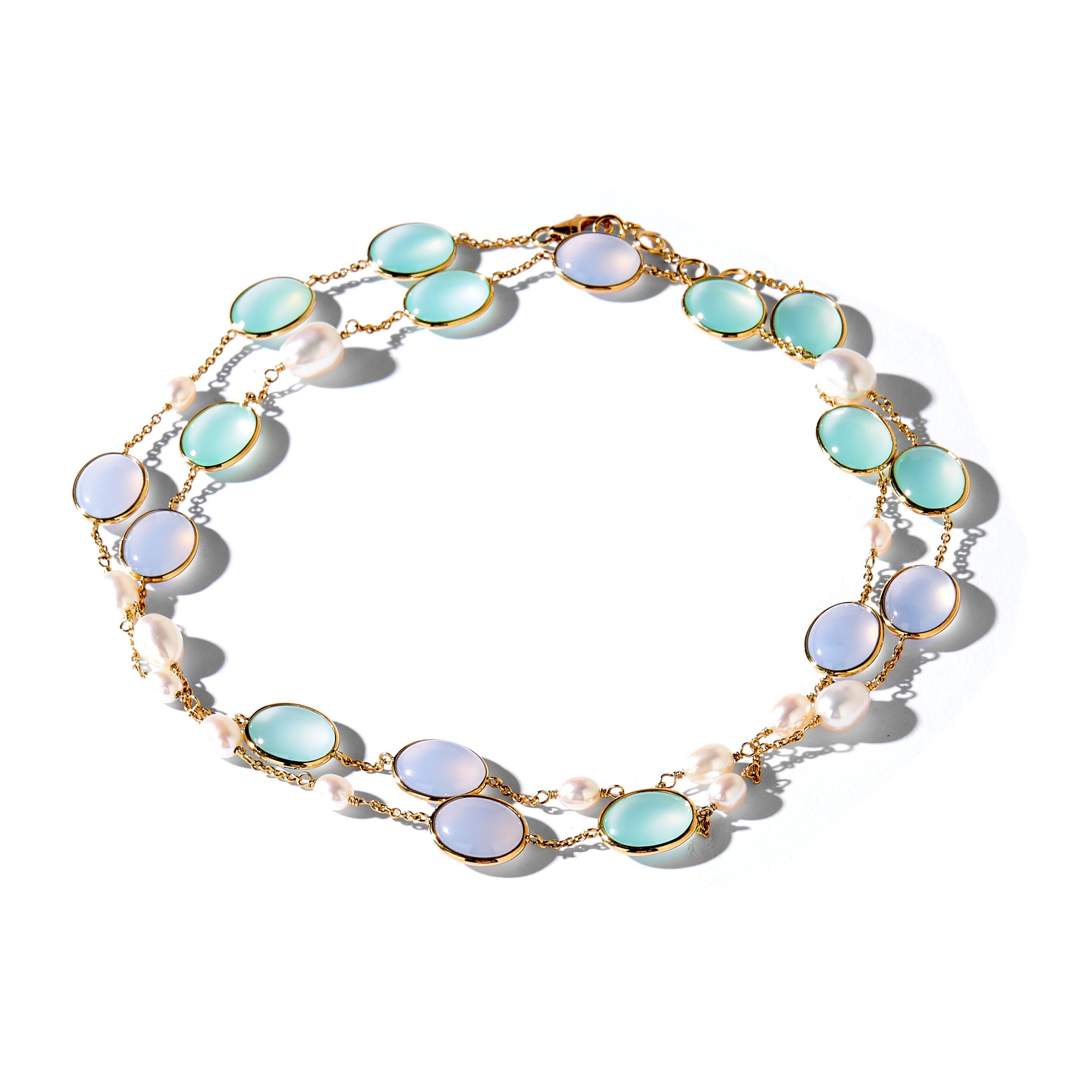 
Created in 18 karat yellow gold
30 inch Necklace
Fresh Water Pearls 27  carats approx.
Blue Chalcedony 37 carats approx.
Sea Green Chalcedony 44 carats approx.

18 karat yellow gold lobster clasp with sizing rings
Limited Edition 

About the