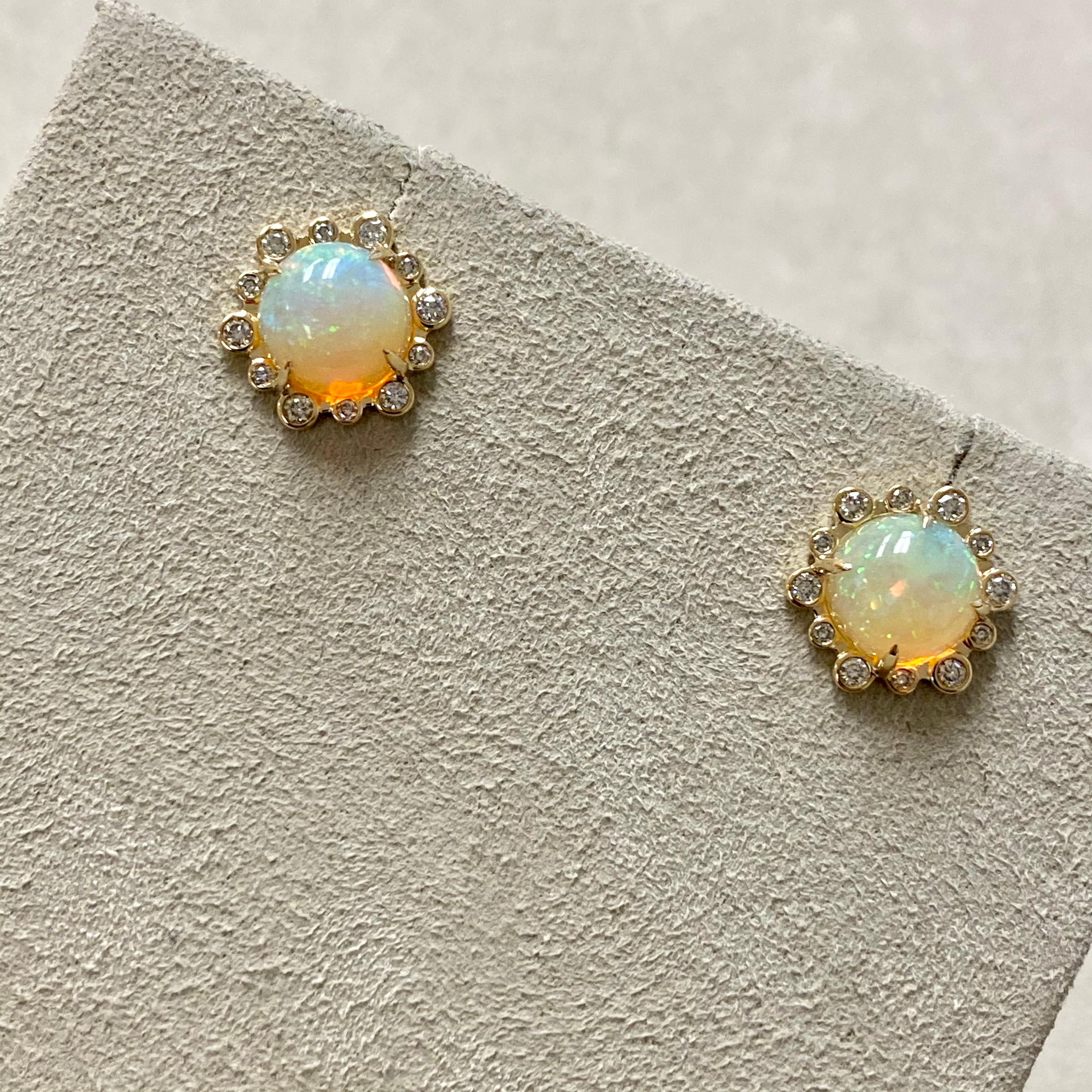 Created in 18 karat yellow gold
Opal 3 carats approx.
Diamonds 0.25 carat approx.
18 karat yellow gold butterfly backs
Limited edition

Adorn yourself in the beauty of these exquisite Candy Blue Topaz and Moon Quartz Earrings, crafted with 18 karat