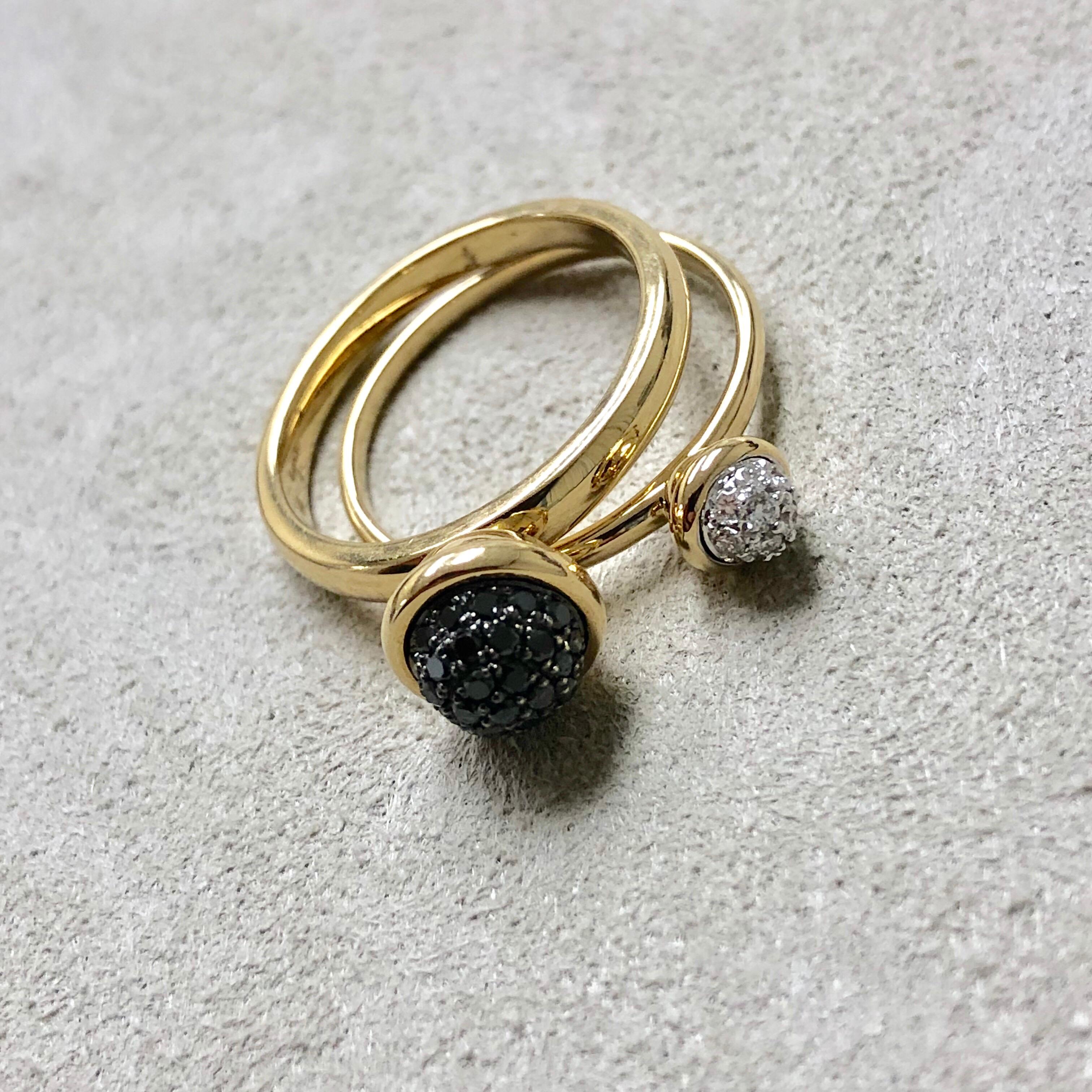 Created in 18 karat yellow gold
Black diamonds 0.30 cts approx
Diamonds 0.10 cts approx
Pair of two stacking rings
Black diamond pave ring 7mm diameter approx
Diamond pave ring 5 mm diameter approx
Ring size US 6.5, can be sized upon
