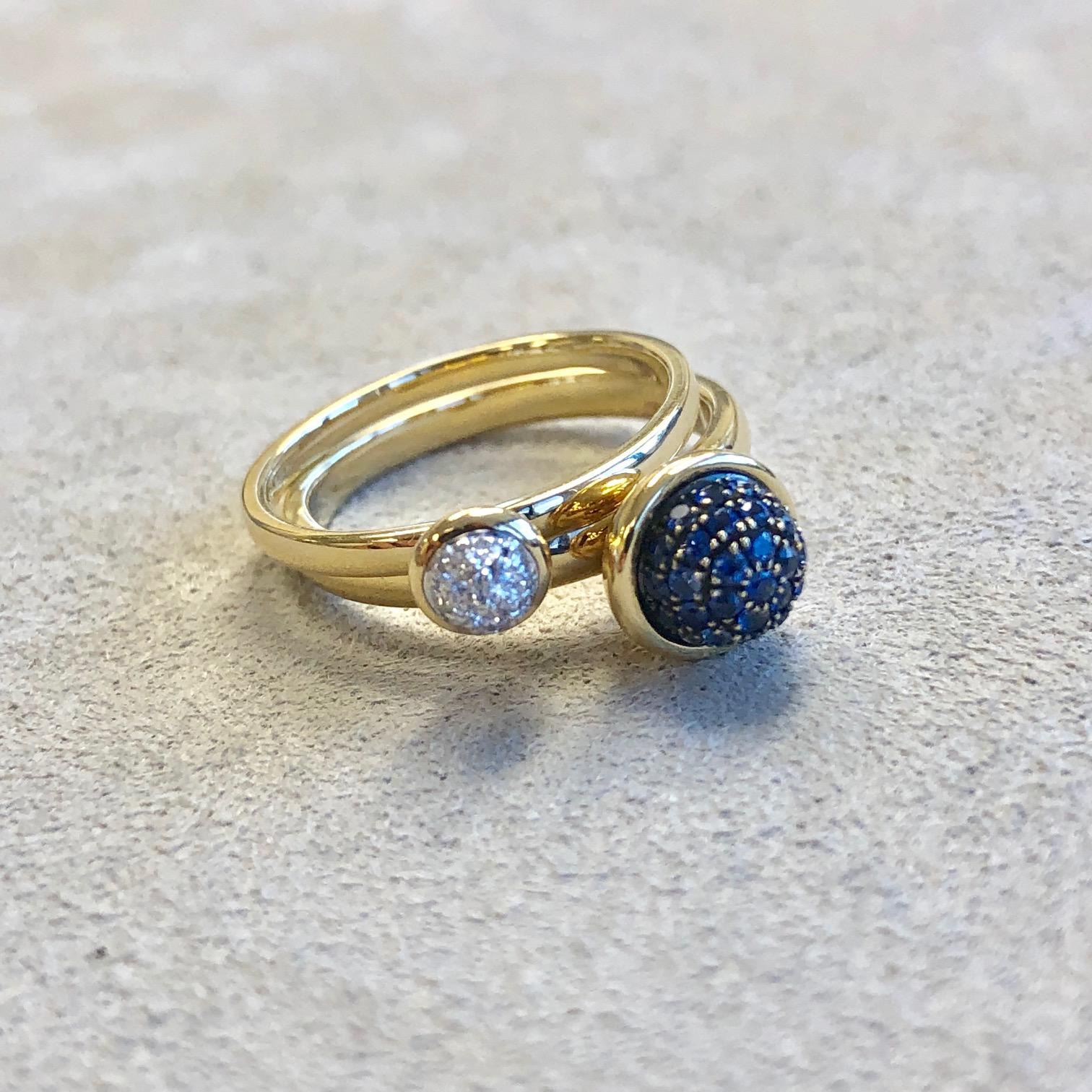 Created in 18 karat yellow gold
Blue sapphire  0.30 cts approx
Diamonds 0.10 cts approx
Pair of two stacking rings
Bleu sapphire pave 7mm diameter approx
Diamond pave ring 5 mm diameter approx
Ring size US 6.5, can be sized upon request.

Enveloped