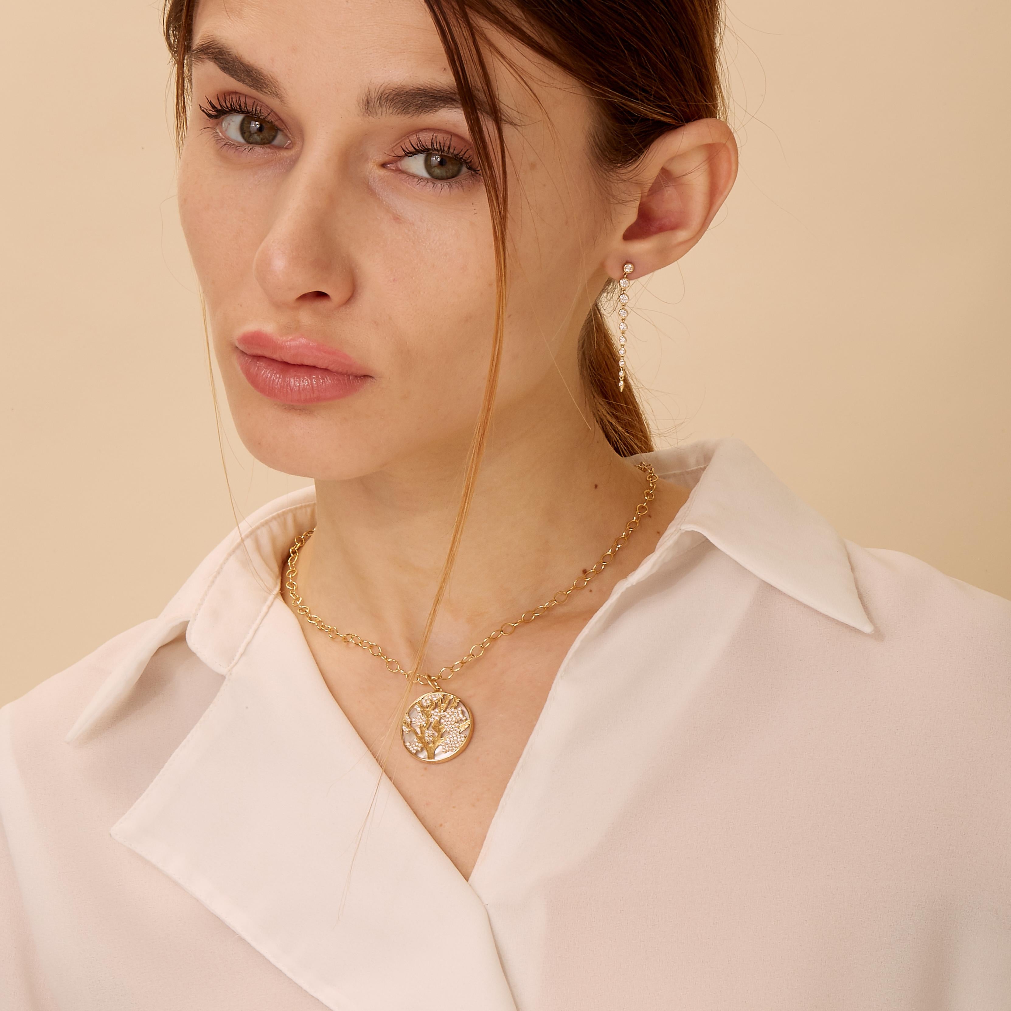 Created in 18 karat yellow gold 
Mother of Pearl 9 carats approx.
Diamonds 0.45 carat approx.
Cherry blossoms
Chain sold separately
Limited Edition

Fashioned in a luxurious 18-karat yellow gold, this exquisite limited-edition necklace renders an