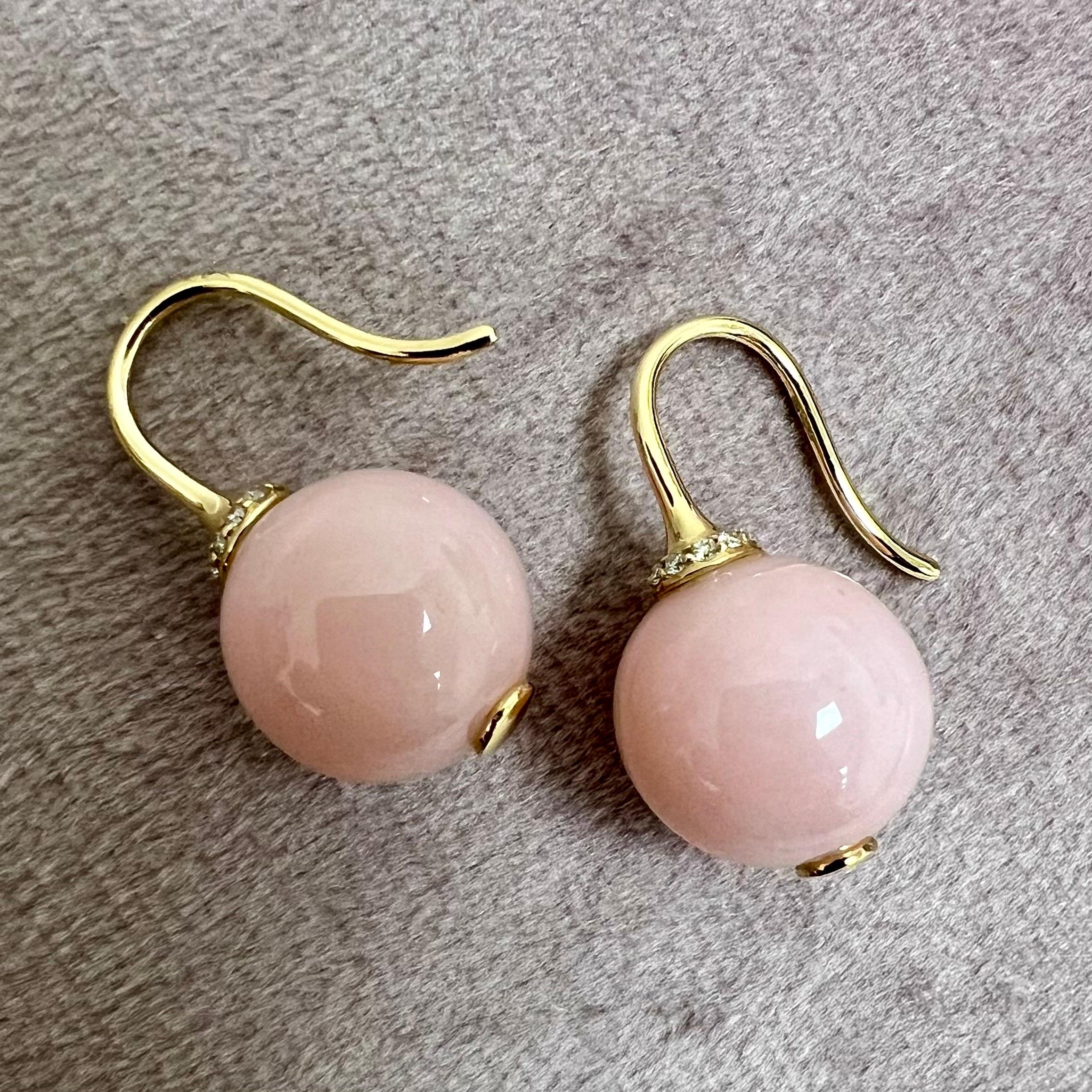 Created in 18 karat yellow gold
Pink Opal beads 10.5 carats approx.
Diamonds 0.10 carat approx.
Limited edition

Crafted from 18 karat yellow gold, these limited edition earrings feature glimmering pink opal beads estimated at 10.5 carats, and