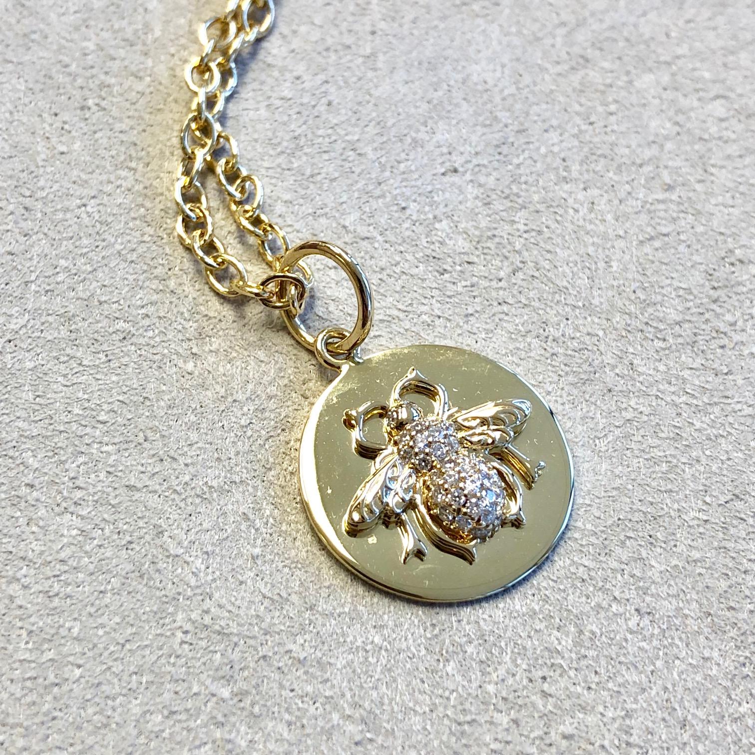 Created in 18 karat yellow gold 
Diamonds 0.15 ct approx
Chain sold separately
Limited edition

Crafted from 18 karat yellow gold, this one-of-a-kind pendant features a hand-painted and hand-carved bone hummingbird, studded with approximately 2