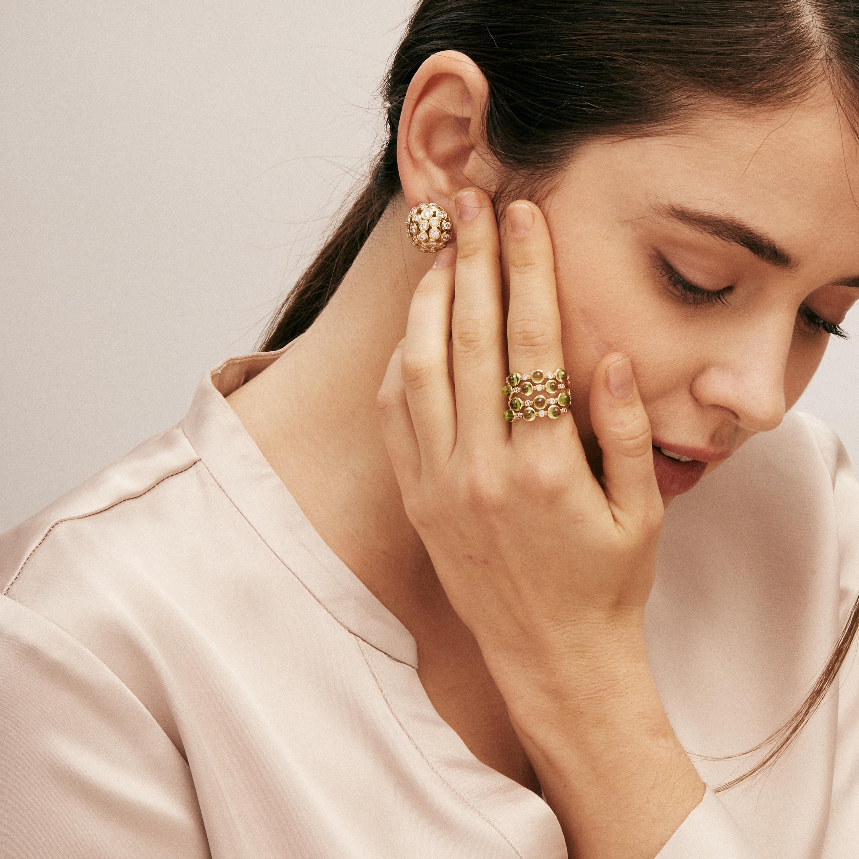 Created in 18 karat yellow gold
Peridot 6 carats approx.
Diamonds 0.25 carat approx.
Band size US 7 
Limited edition

Exquisitely handcrafted in 18 karat yellow gold, this limited edition ring features a luminous 6 carat peridot gemstone surrounded