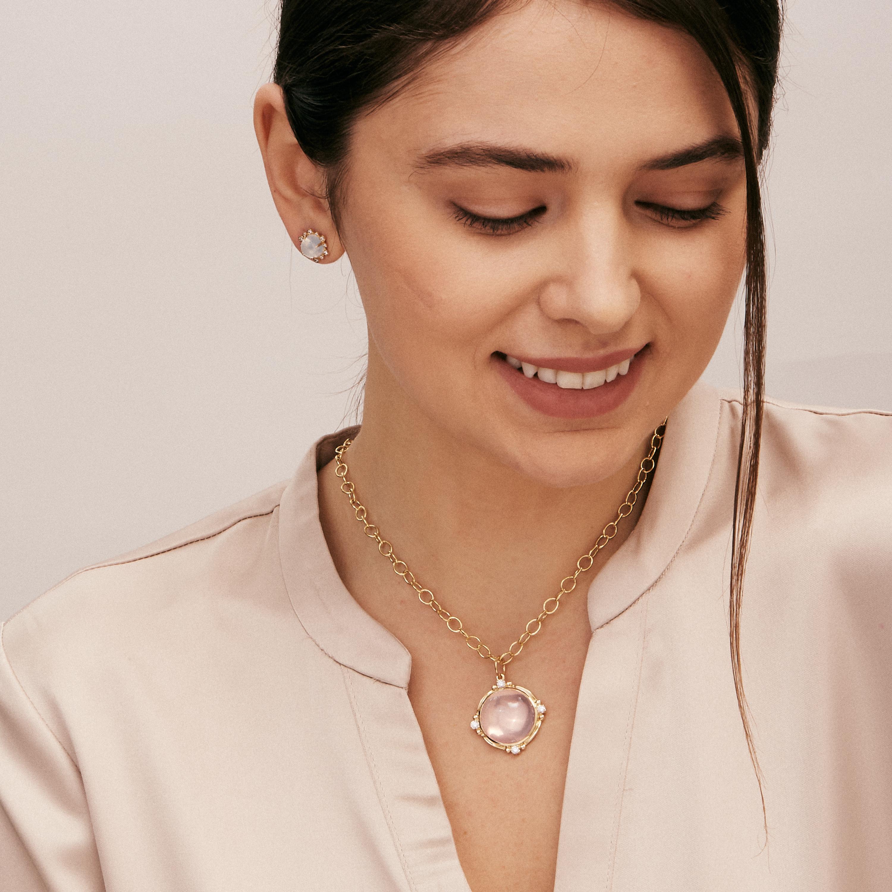 Created in 18kyg
Rose quartz 25 carats approx.
Champagne diamonds 0.35 carat approx.
Chain sold separately 
Limited edition

Framed in stunning 18 karat yellow gold, this limited edition, handcrafted pendant showcases an impressive 25 carat rose