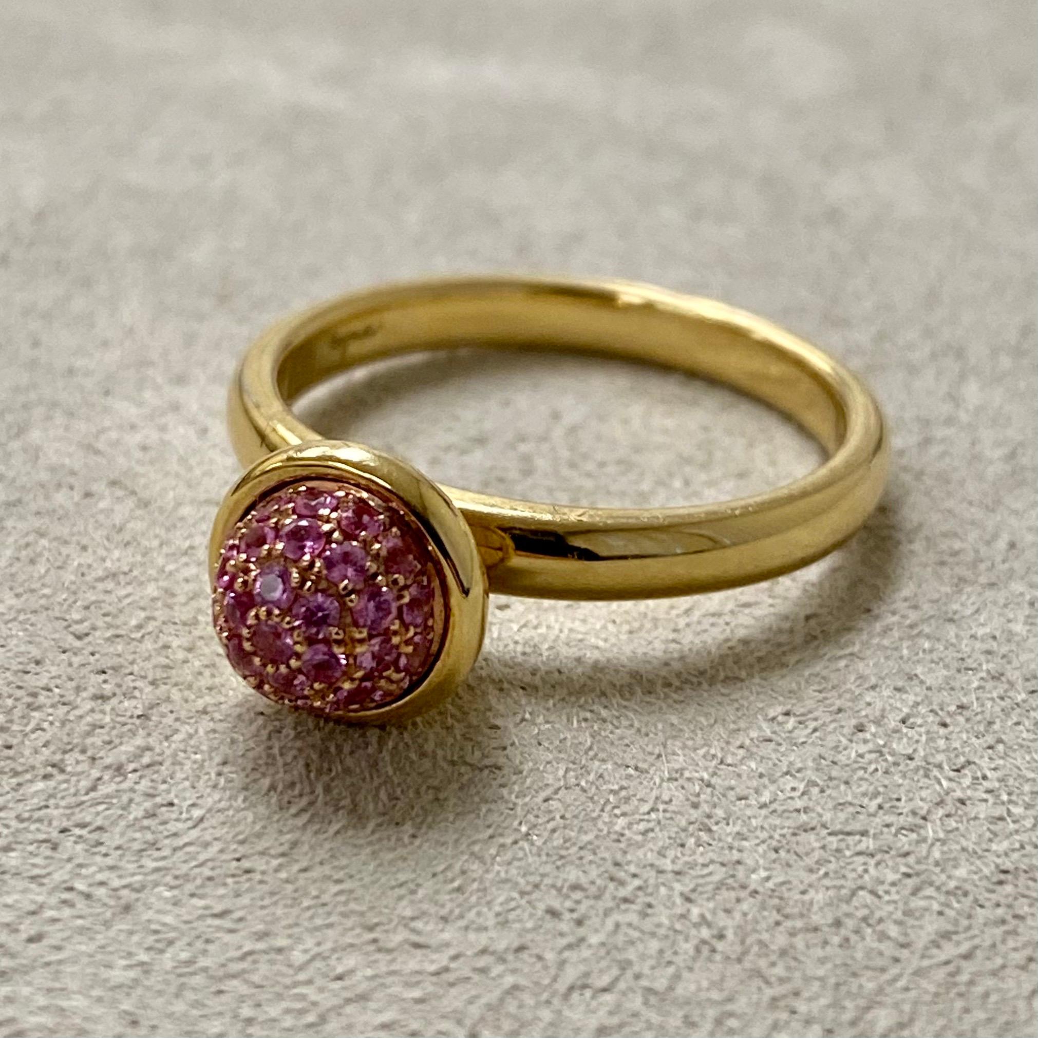 Created in 18 karat yellow gold
Pink sapphires 0.30 carat approx.
Pink sapphire pave ring 8 mm diameter approx.
Ring size US 6.5, can be sized upon request.

Crafted from 18 karat yellow gold, this striking ring features 0.30 carat of glimmering