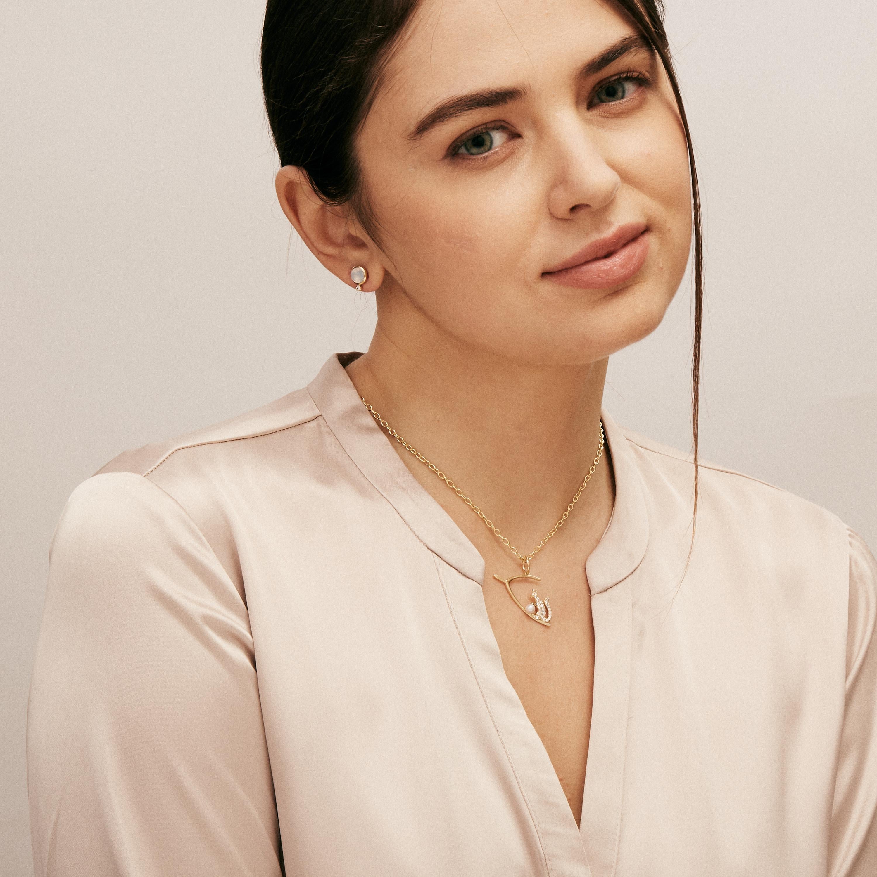 Created in 18 karat yellow gold
Pearl 0.40 carat approx.
Champagne diamonds 0.20 carat approx.
Chain sold separately


About the Designers ~ Dharmesh & Namrata

Drawing inspiration from little things, Dharmesh & Namrata Kothari have created an