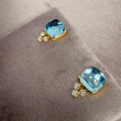 Pendientes de oro amarillo Syna con topacio azul y diamantes