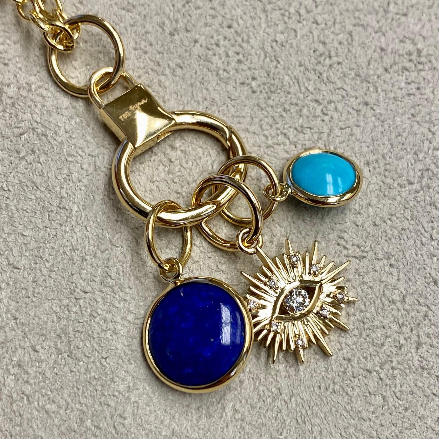Created in 18 karat yellow gold
Lapis lazuli 3.50 carats approx.
Turquoise 1 carat approx.
Diamonds 0.10 carat approx.
Limited edition
Chain sold separately

Finely crafted from 18 karat yellow gold, this limited edition charms is adorned with Lapis