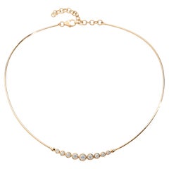 Collar tubular Syna de oro amarillo con diamantes