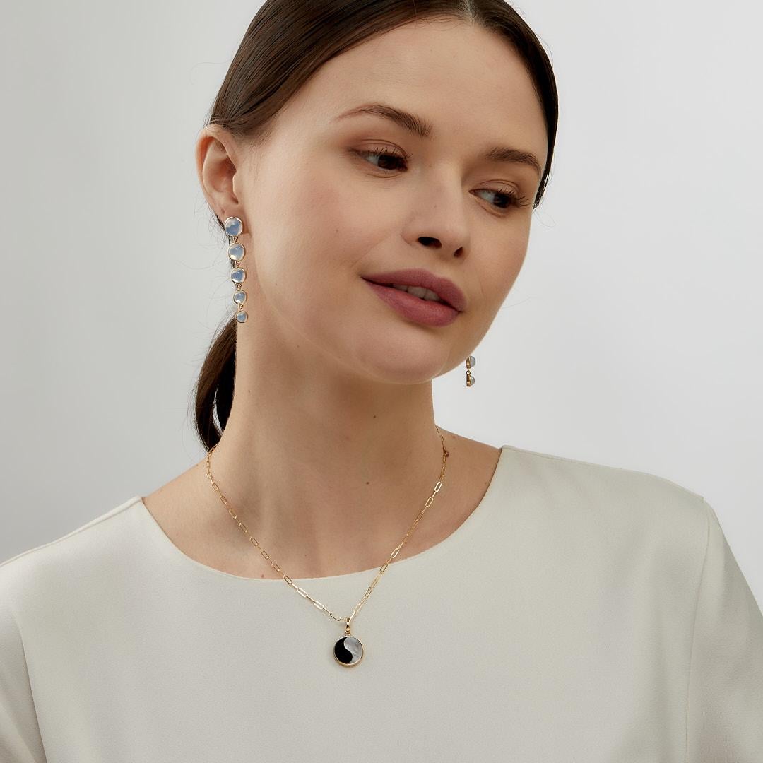 Created in 18 karat yellow gold
Black onyx and mother of pearl
Diamonds 0.03 carat approx.
Chain sold separately


 About the Designers ~ Dharmesh & Namrata

Drawing inspiration from little things, Dharmesh & Namrata Kothari have created an